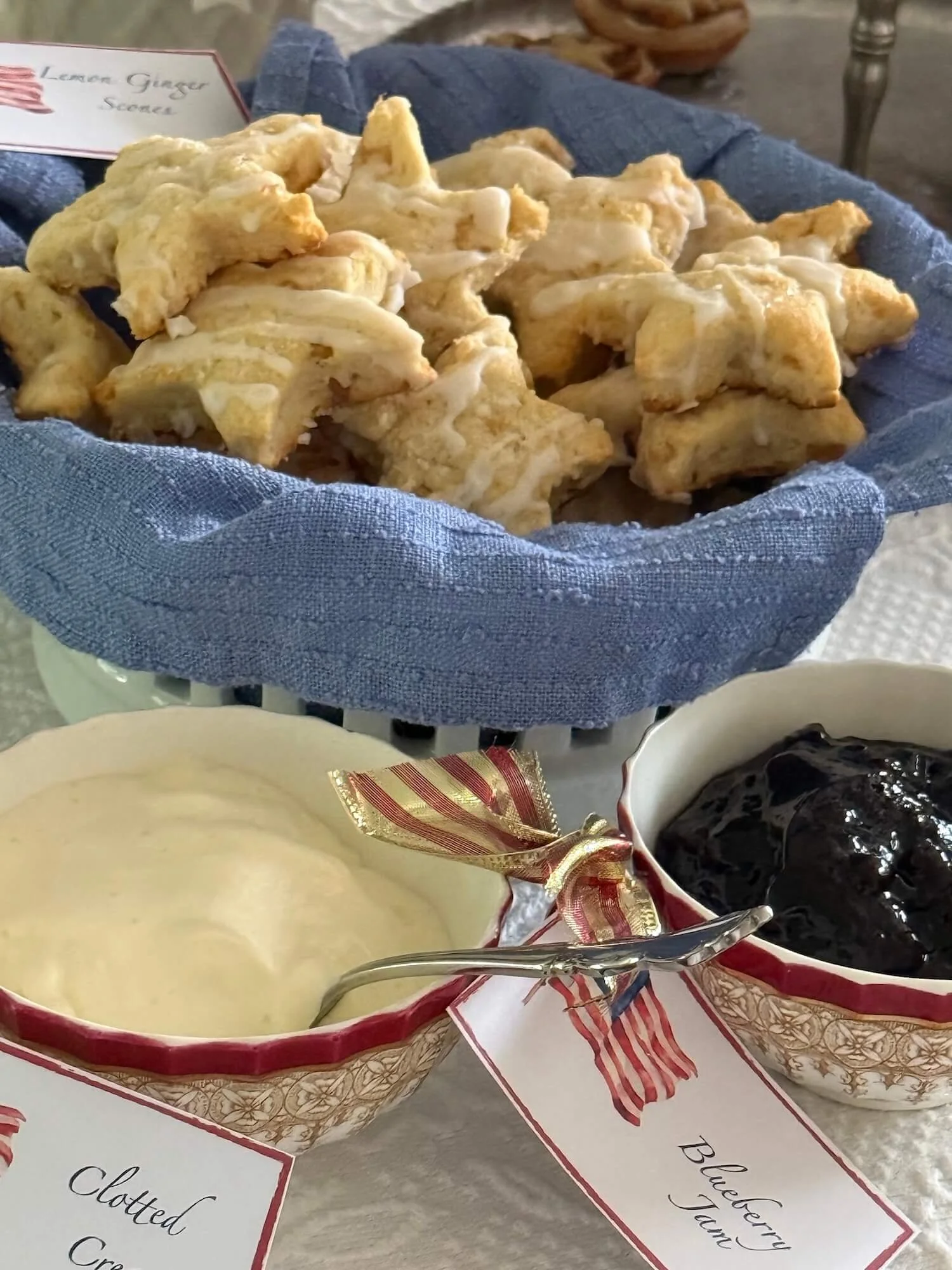 lemon ginger scones with clotted cream and blueberry jam