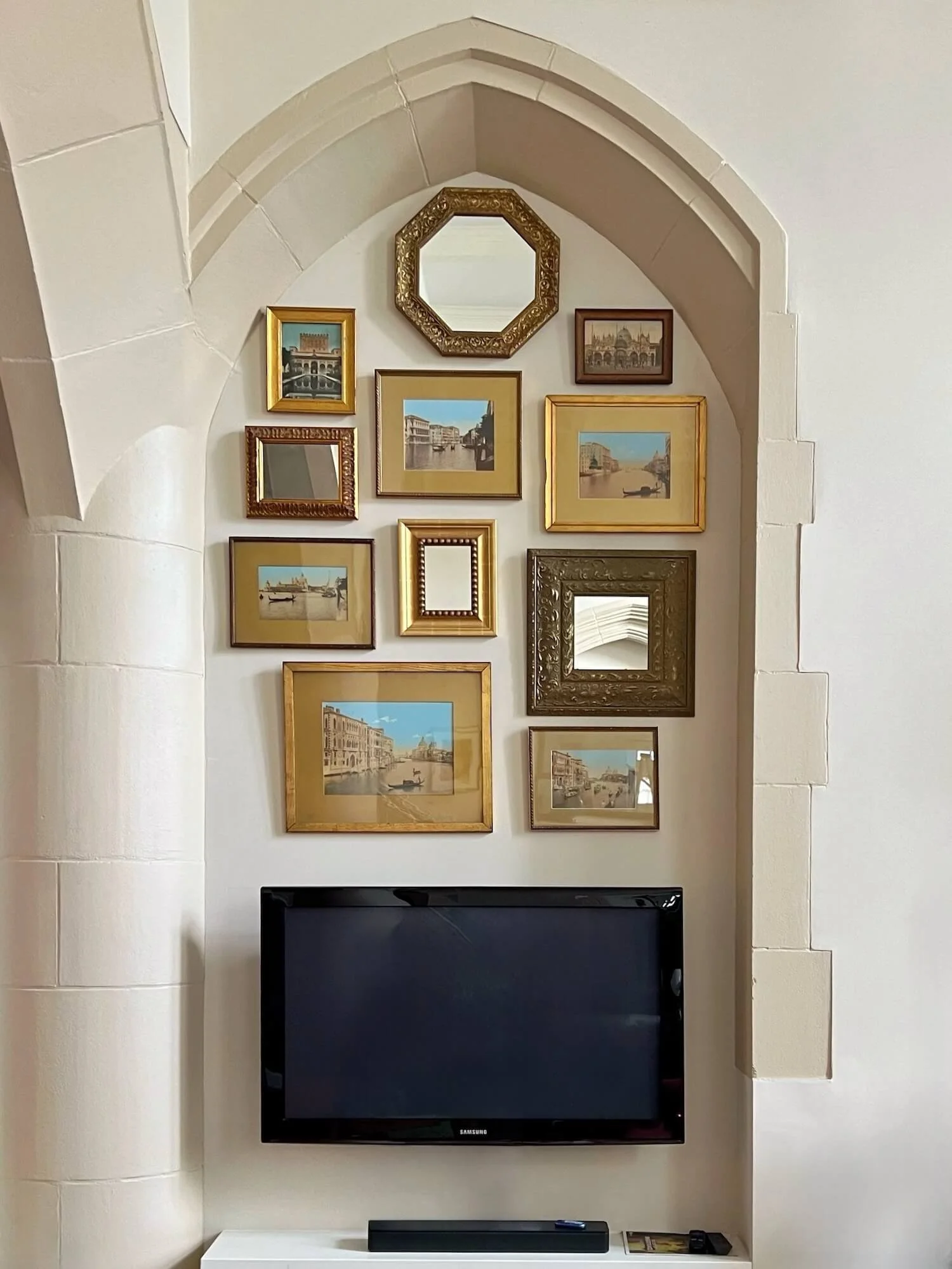 vintage venice prints fill a wall niche