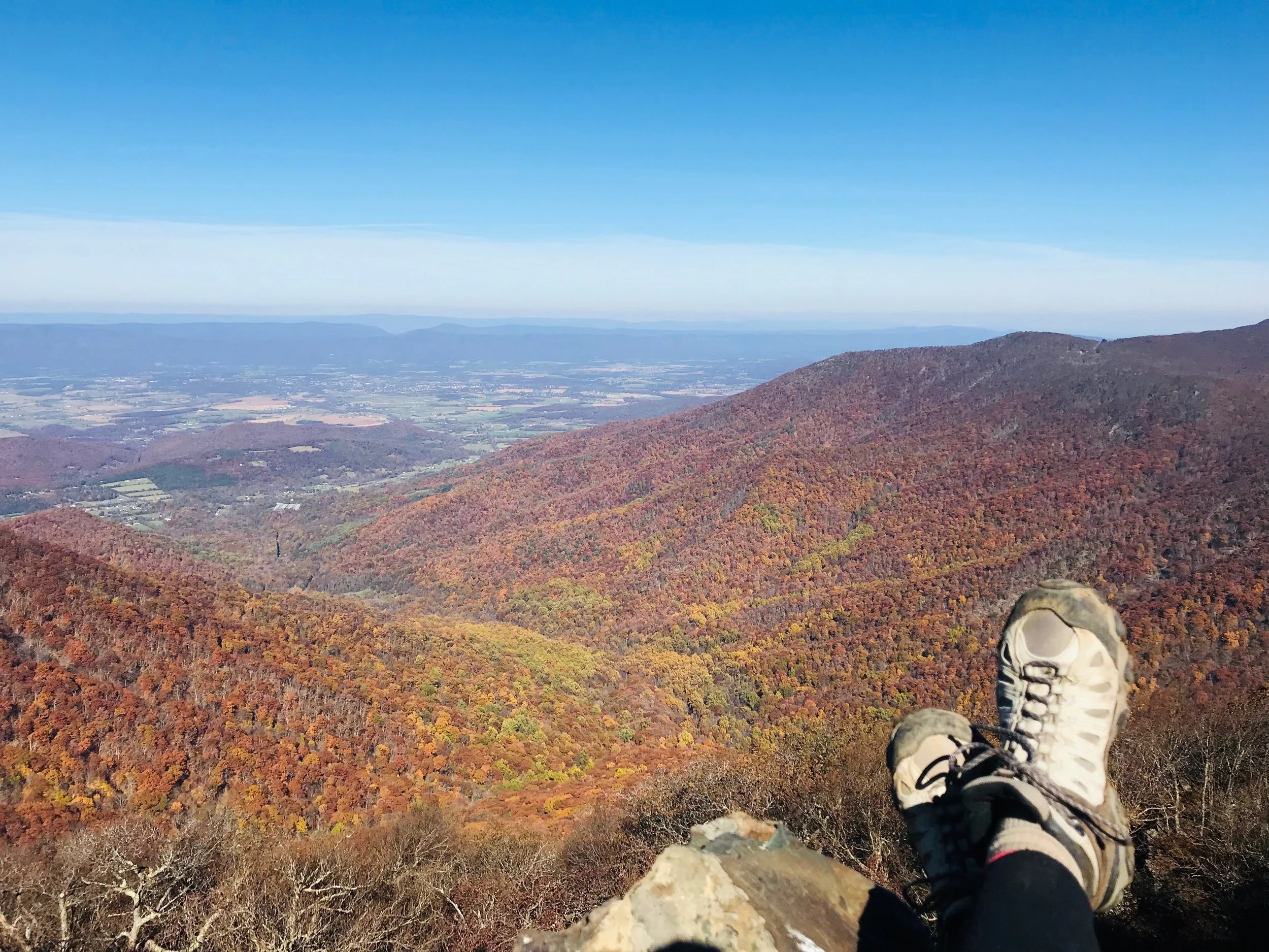 Relaxing at the top of Hawskbill Mountain. At 4,050 feet, it’s the highest point in Shenandoah National Park, yet with a moderate rating, the 2.9-mile Hawksbill Loop Hike is fairly easy and quick. Take the AT up and the Lower Hawksbill back for a change of scenery.