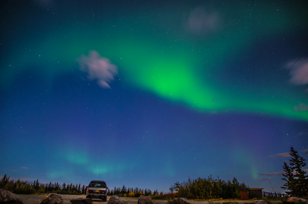 Northern Lights in Alaska with a car in background.png