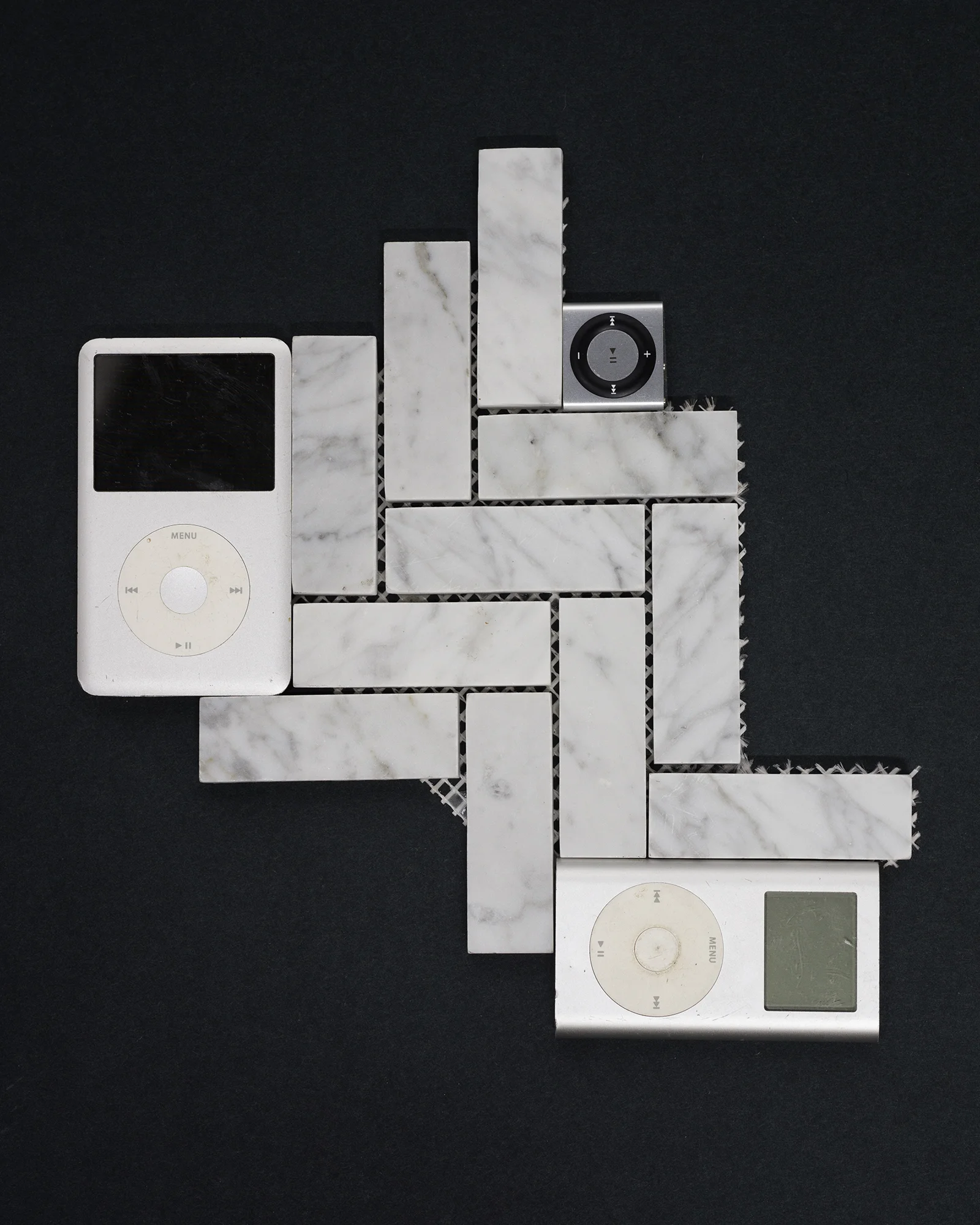Do the Dance iSculpture , 2016, marble tile, iPods, iPod Shuffle, 15” x 13” x .5”.