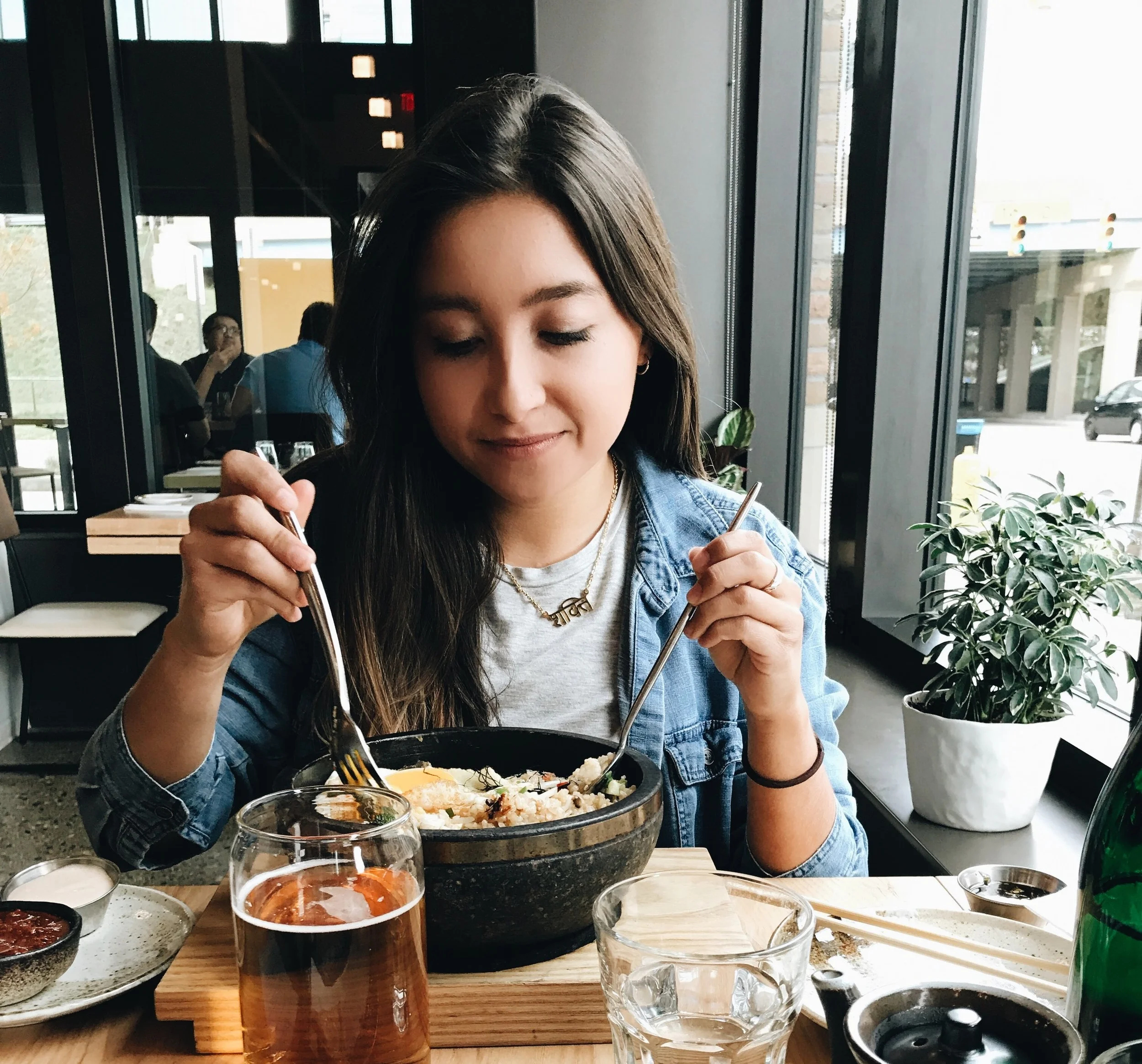 Me eating bibimbop (gotta get it in the stone bowl so it sizzles) and Sapporo on draft