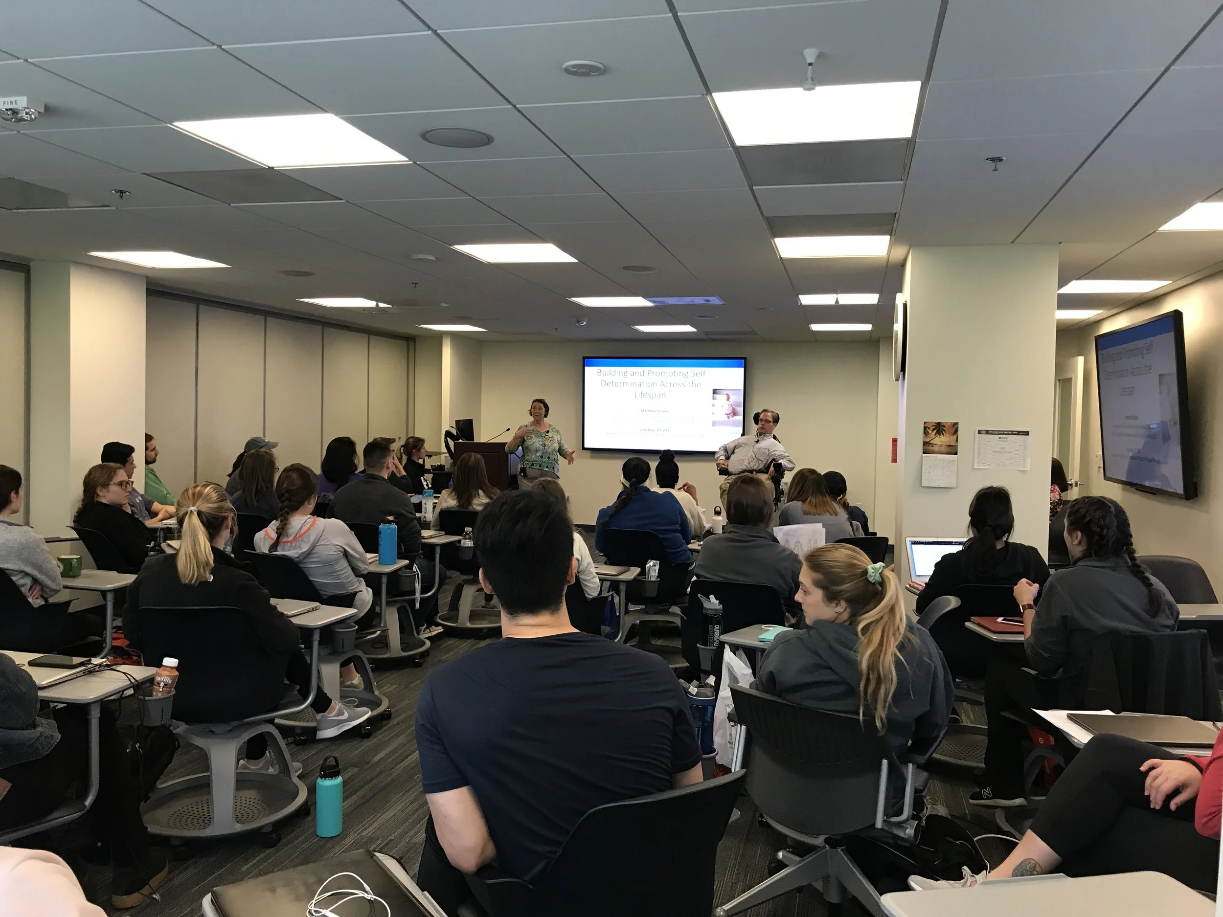 PHOTO: Matthew speaking to OT and PT Students at George Washington University about the importance of developing self-determination within their patients.
