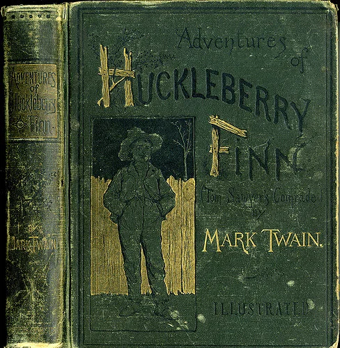 A first edition copy of The Adventures of Huckleberry Finn (1885). Image from William Creswell .