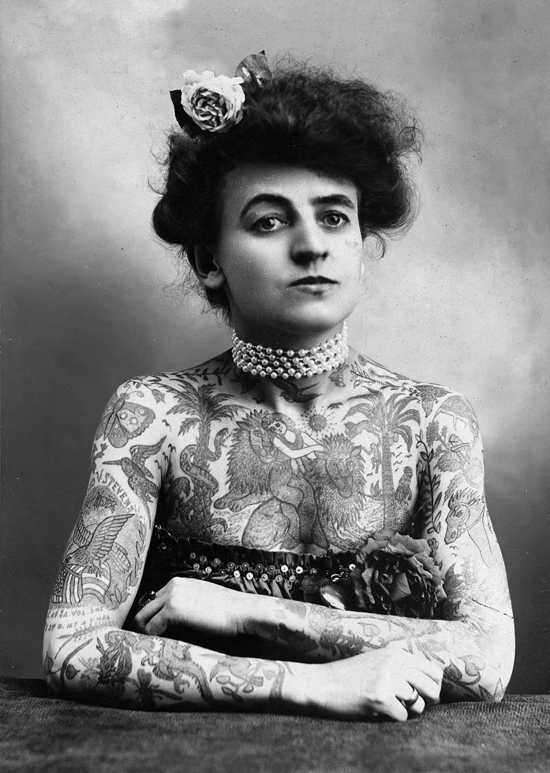 Maud Stevens Wagner with arms and chest covered in tattoos. Click HERE for the source.