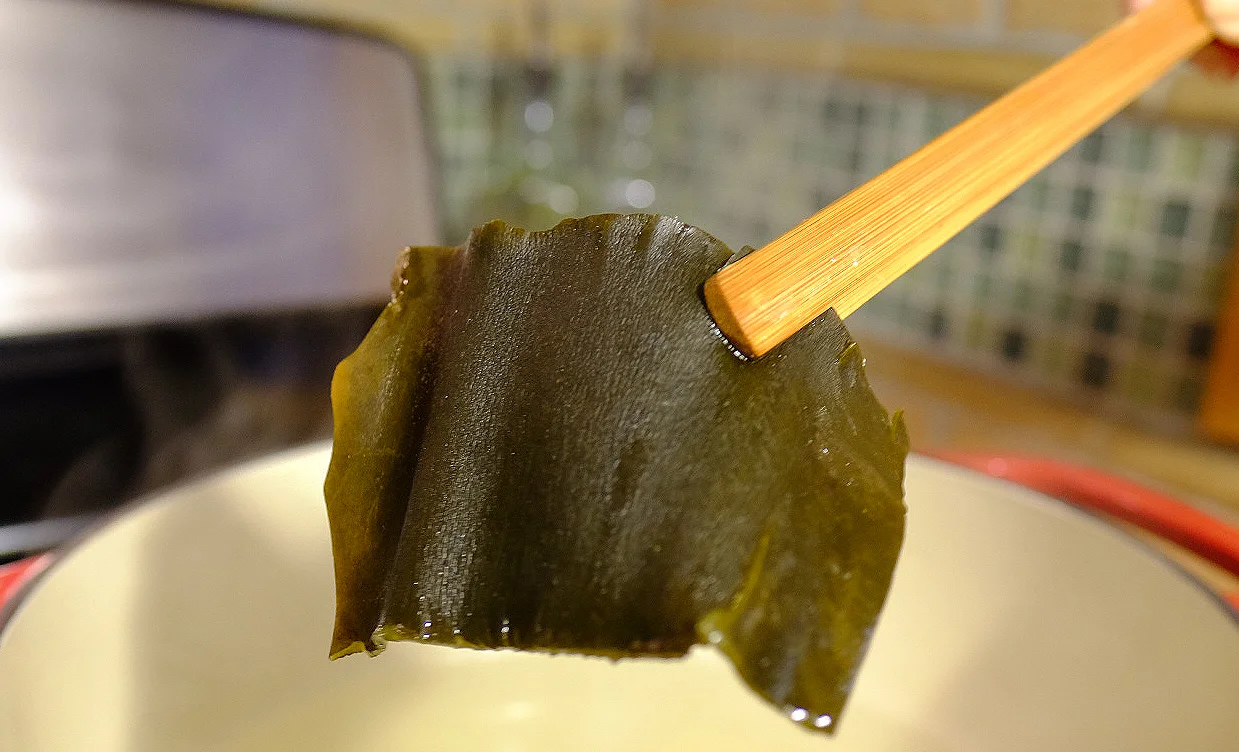 Photo by Melissa DeVaughn Konbu can be cut into pieces and simmered in hot water to create a soup stock, or dashi , that provides a rich yet subtle flavor prized in Japanese cuisine. Hokkaido's konbu is some of the best in the world.