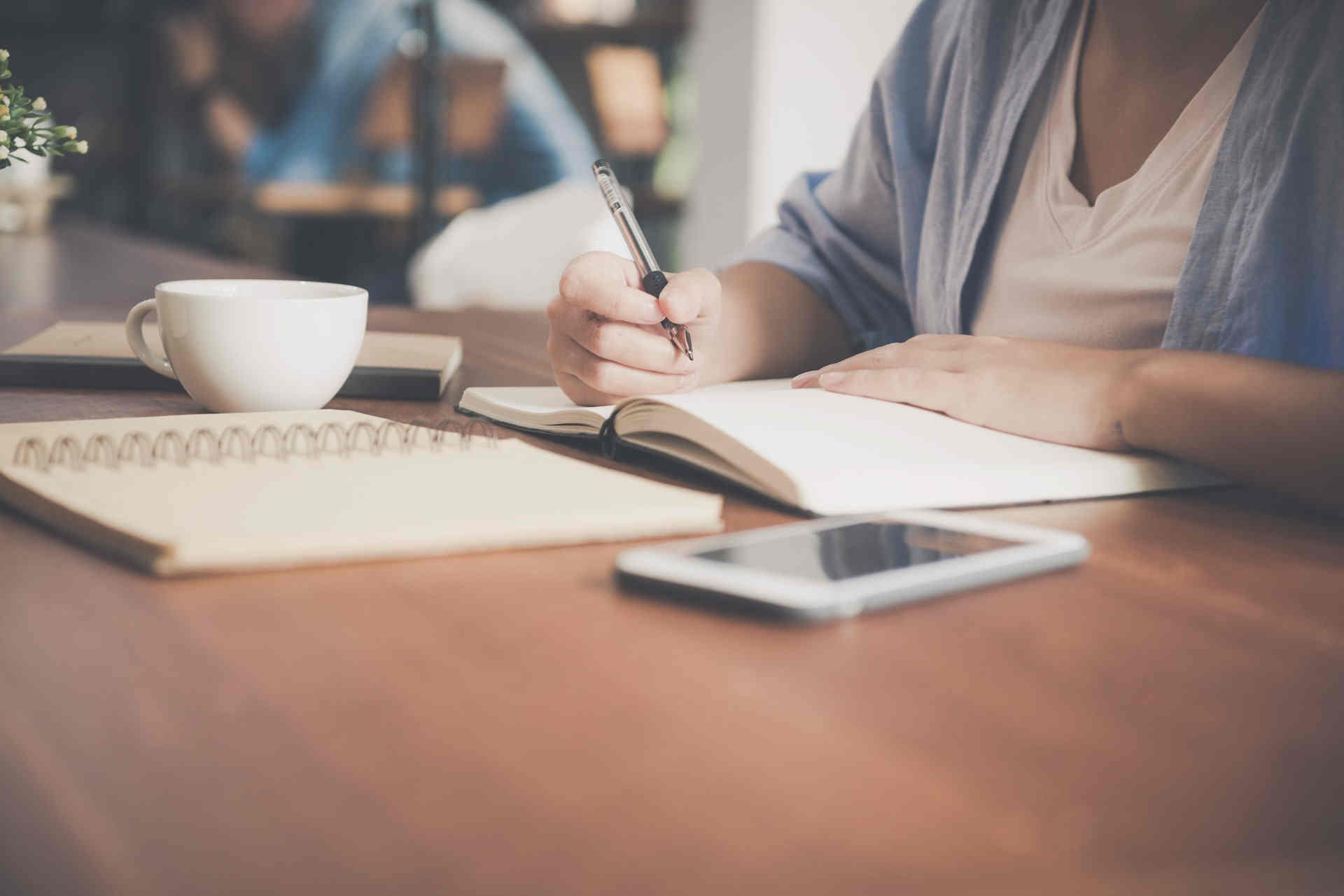 woman writing notes.jpeg