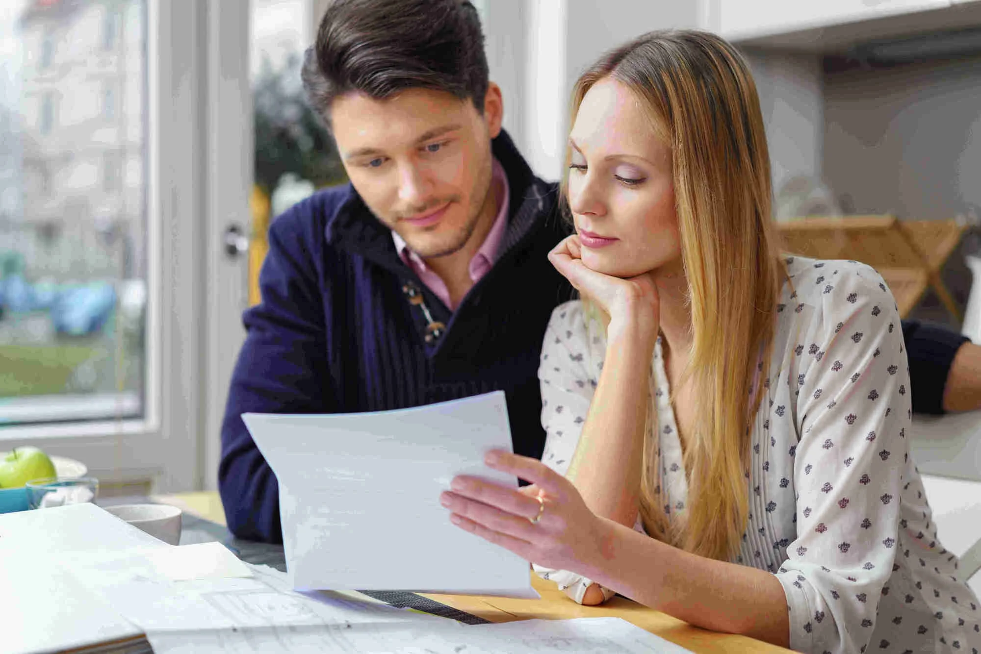 young couple reading a contract.jpg