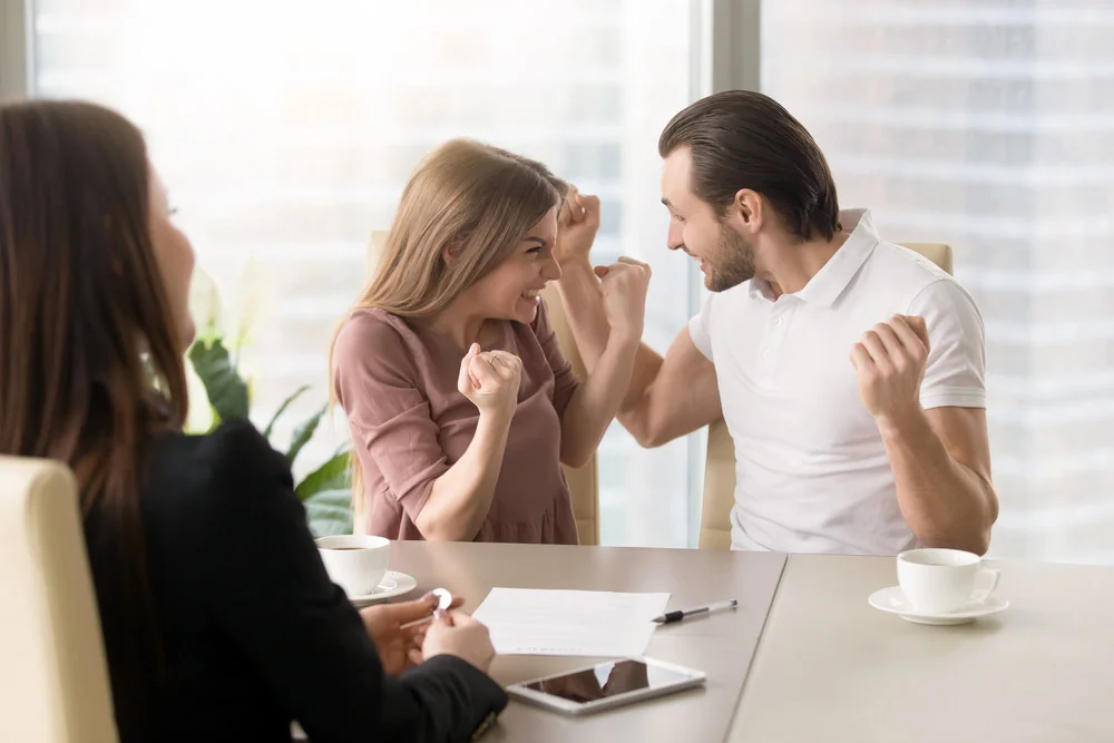 couple celebrate in service provider's office.jpg
