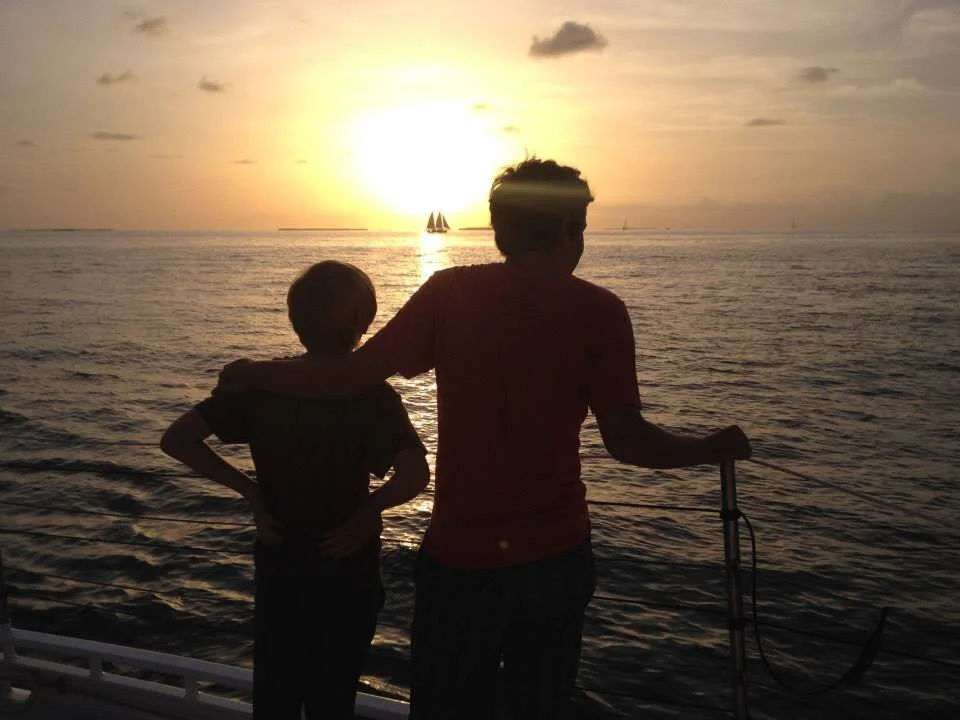 Auggie and younger brother sailing off Key West, Florida (a few years back).