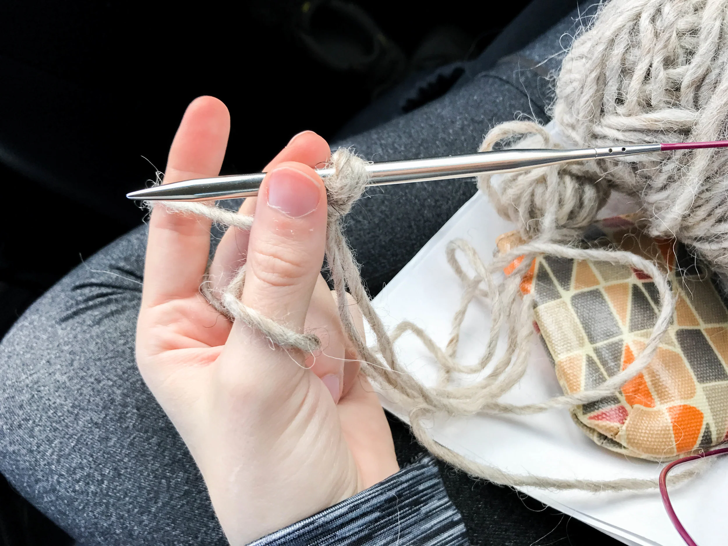 1. Instead of making your slip-knot out of the same yarn, double up with either the other end of your current ball or one of your others and make the slip knot with both. You'll use one strand around your pointer finger and the other for your thumb. CO like normal.