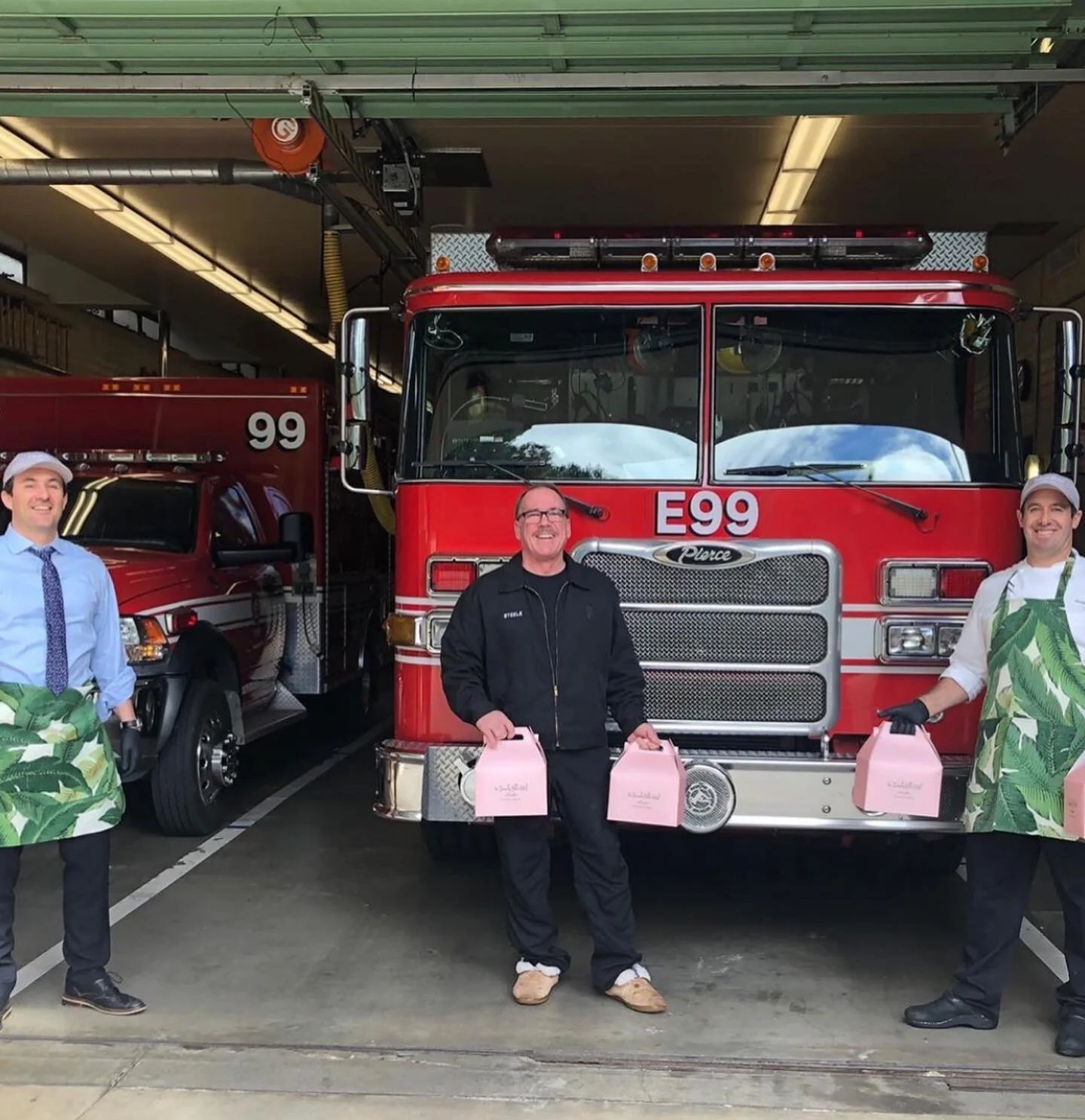   Beverly Hills Firefighters wearing Tudaloo aprons donating food  