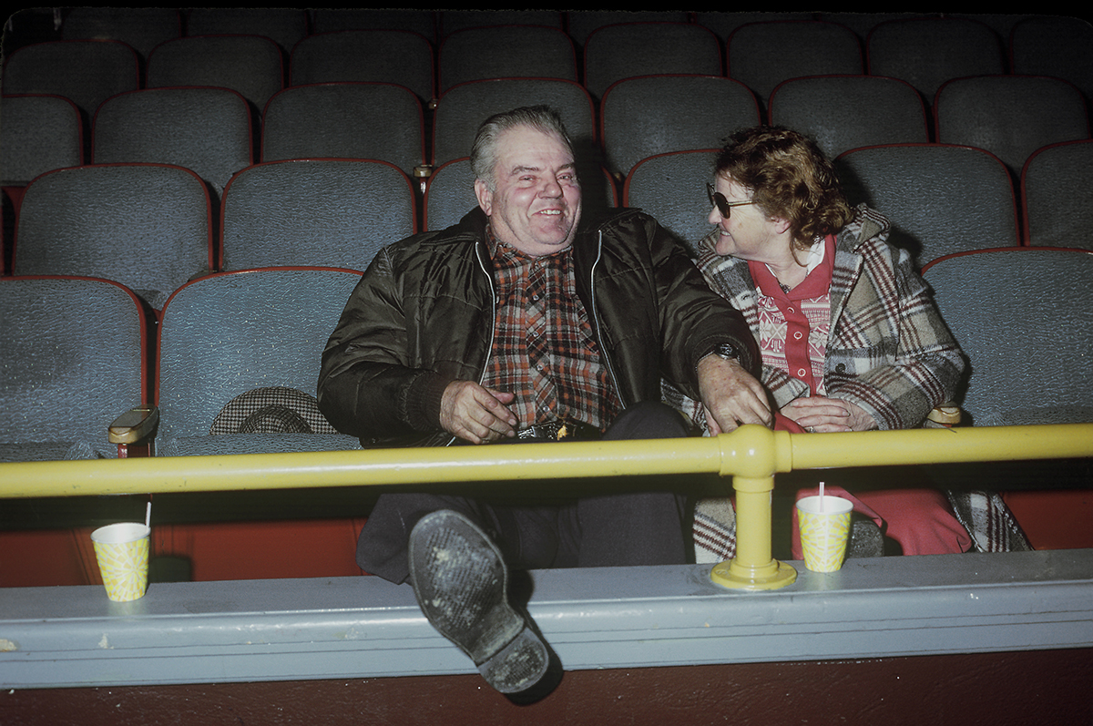 Couple watching big time wrestling