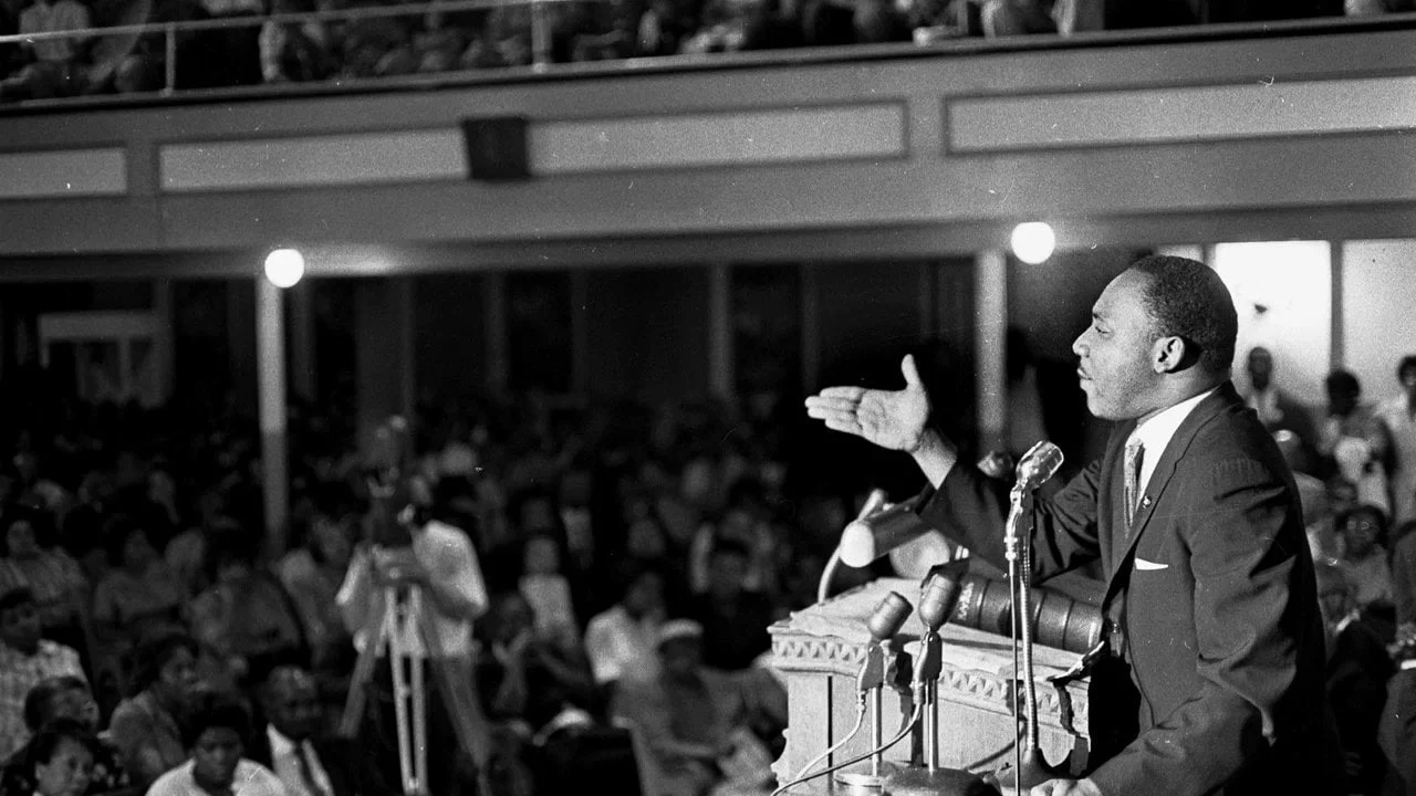 Preaching to his congregation.