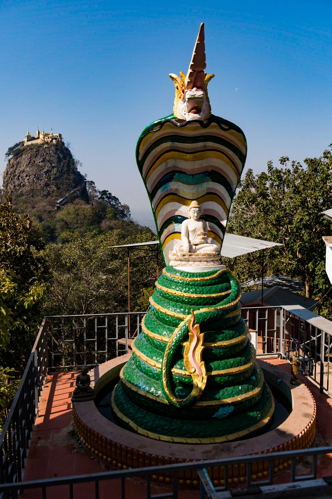 Mount Popa viewed from one of the first temples off the main road. Ignore the ten-foot-tall cobra Buddha...it was only for scale. 😉