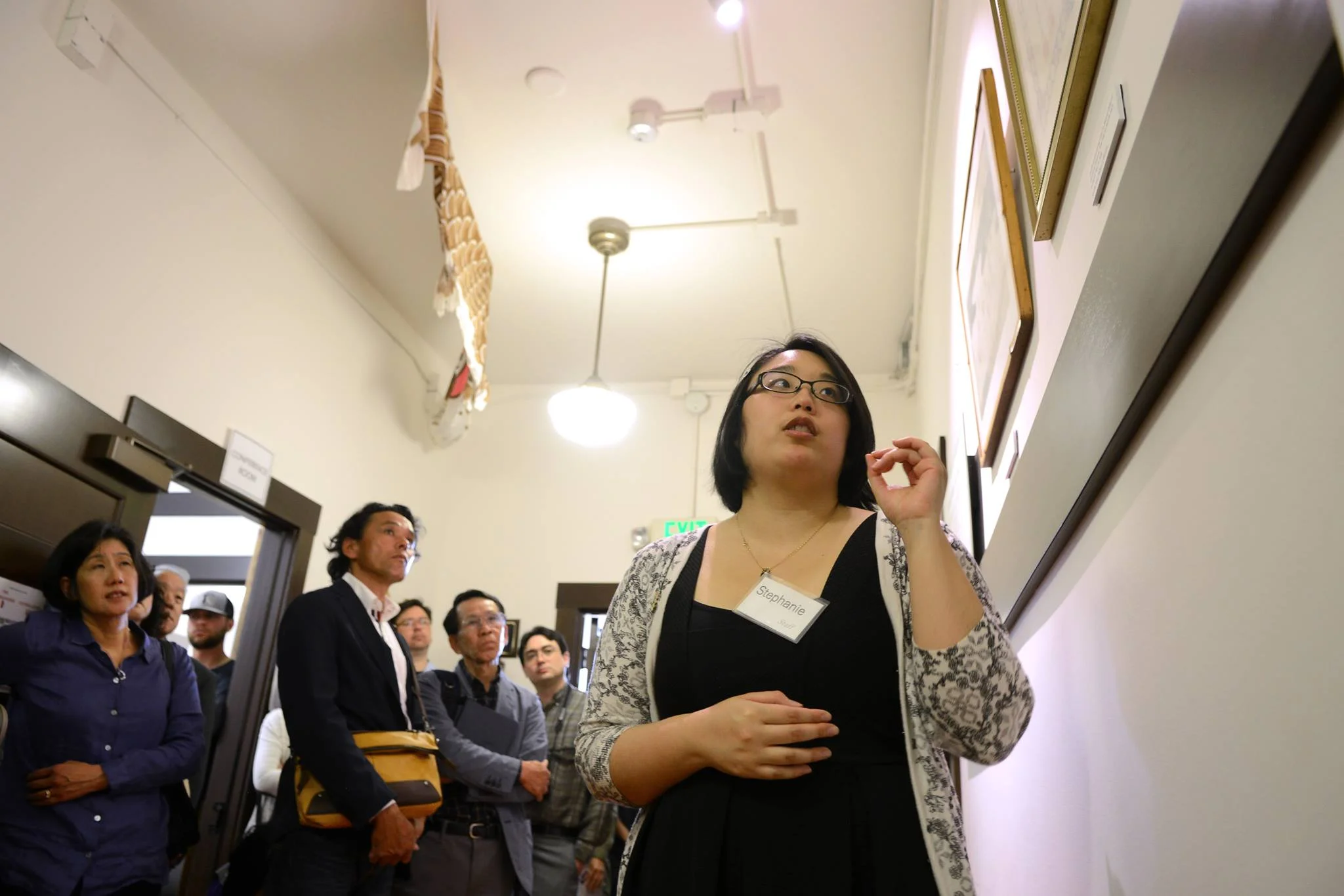 Stephanie Ikeda leads a tour of the Genji Mihara: An Issei Pioneer exhibit in May 2018. Photo: Tyler Sipe