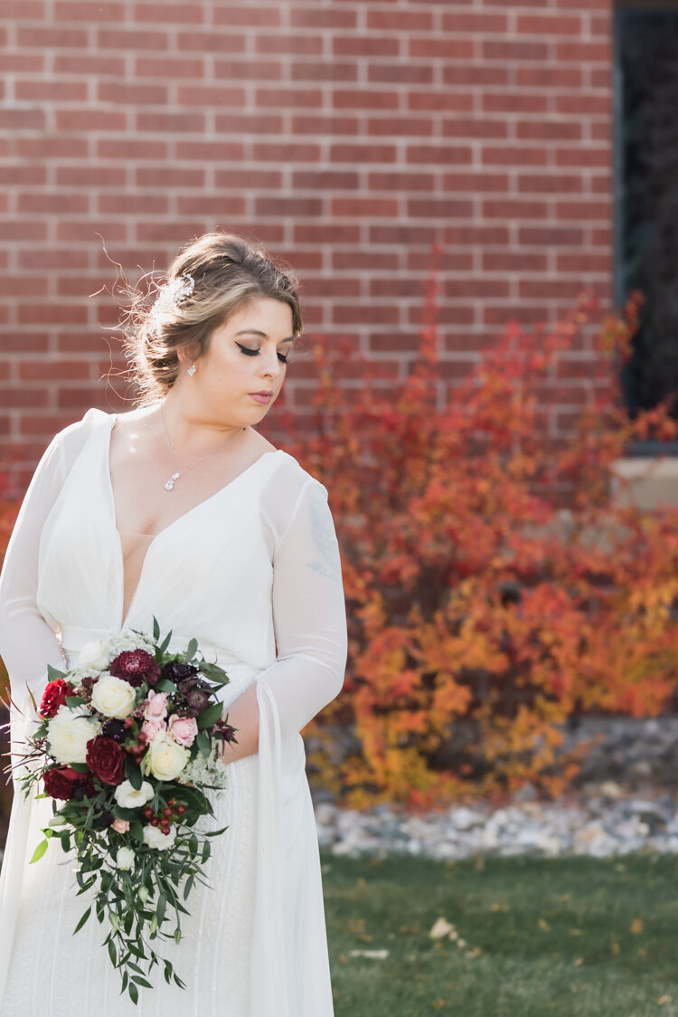 Bride looking over her shoulder at fall Fargo ND wedding