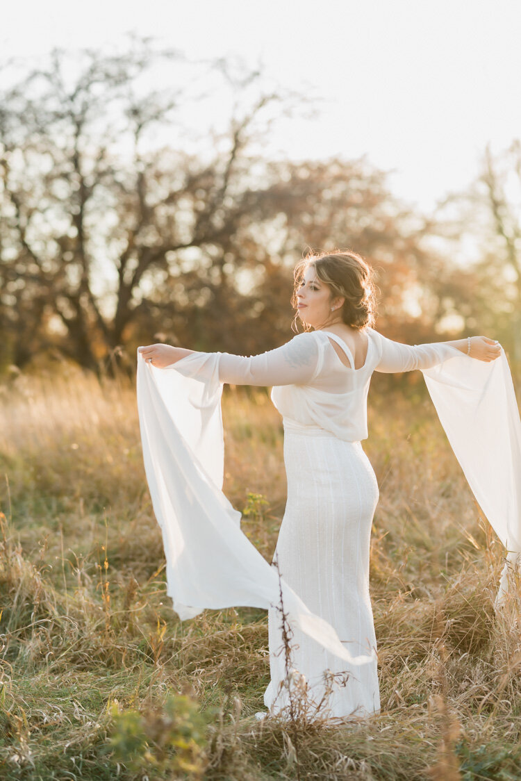 Bride dancing alone in a field at sunset - Fargo, ND wedding | Chelsea Joy Photography