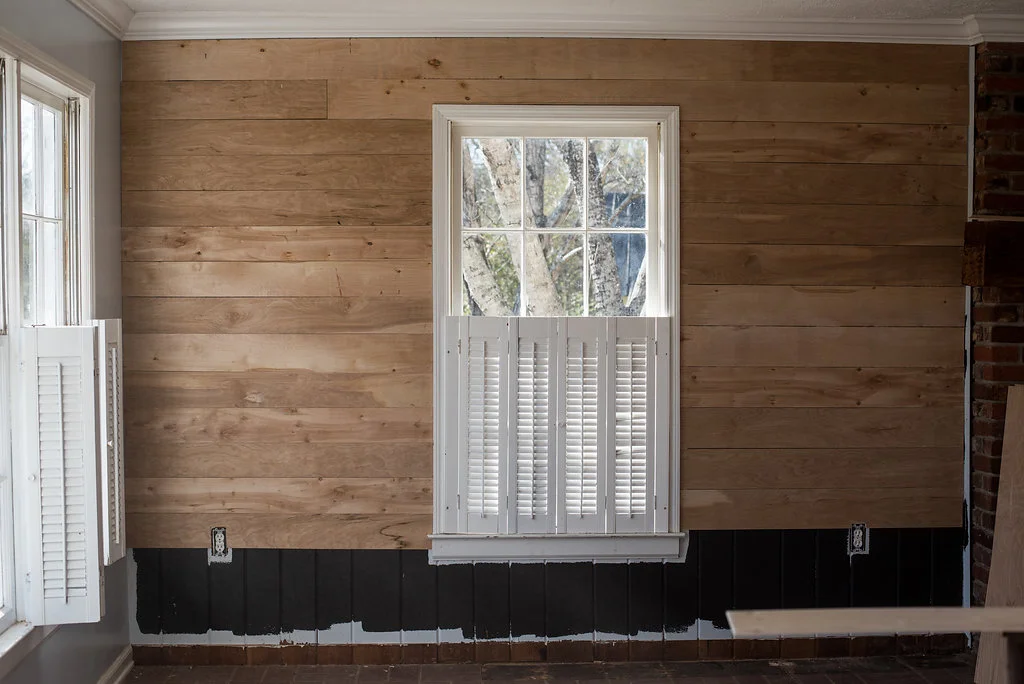 For shiplap, I first painted the walls black. Lesson learned don't paint the wall black LOL! Instead used black felt or roofing paper. Anyways, next I went to my local Home Deopt and bought quarter inch plywood and had them cut it into 6 inch slats. It was super easy to put up! | PC: Emily Reedstrom