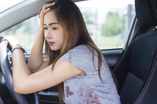 Anxious woman In car