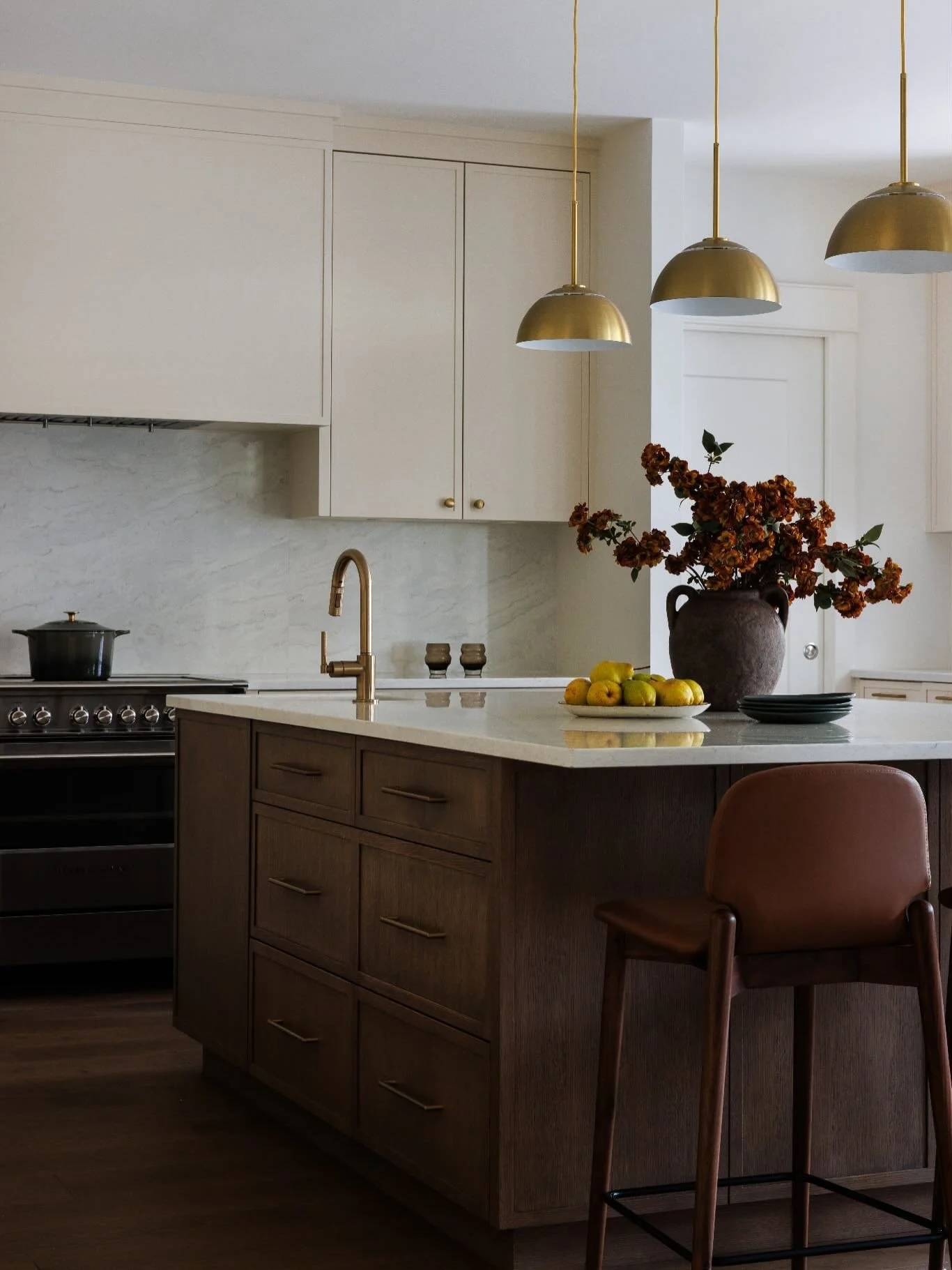 Mid-toned woods are making a strong return to the kitchen and our Grand Boulevard remodel project is a reflection of this shift.
After years of lighter, cooler palettes, we&rsquo;re seeing a move toward finishes that feel warmer, richer and more grou