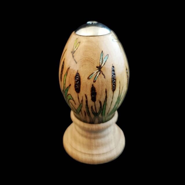 For the first day of Spring!  Cattails and dragonflies woodburned egg kaleidoscope and wooden stand.  #kaleidoscope #eggscope #woodburning #woodburnedart #springart #springartproject #burnedbyhand #dragonflyart #cattails