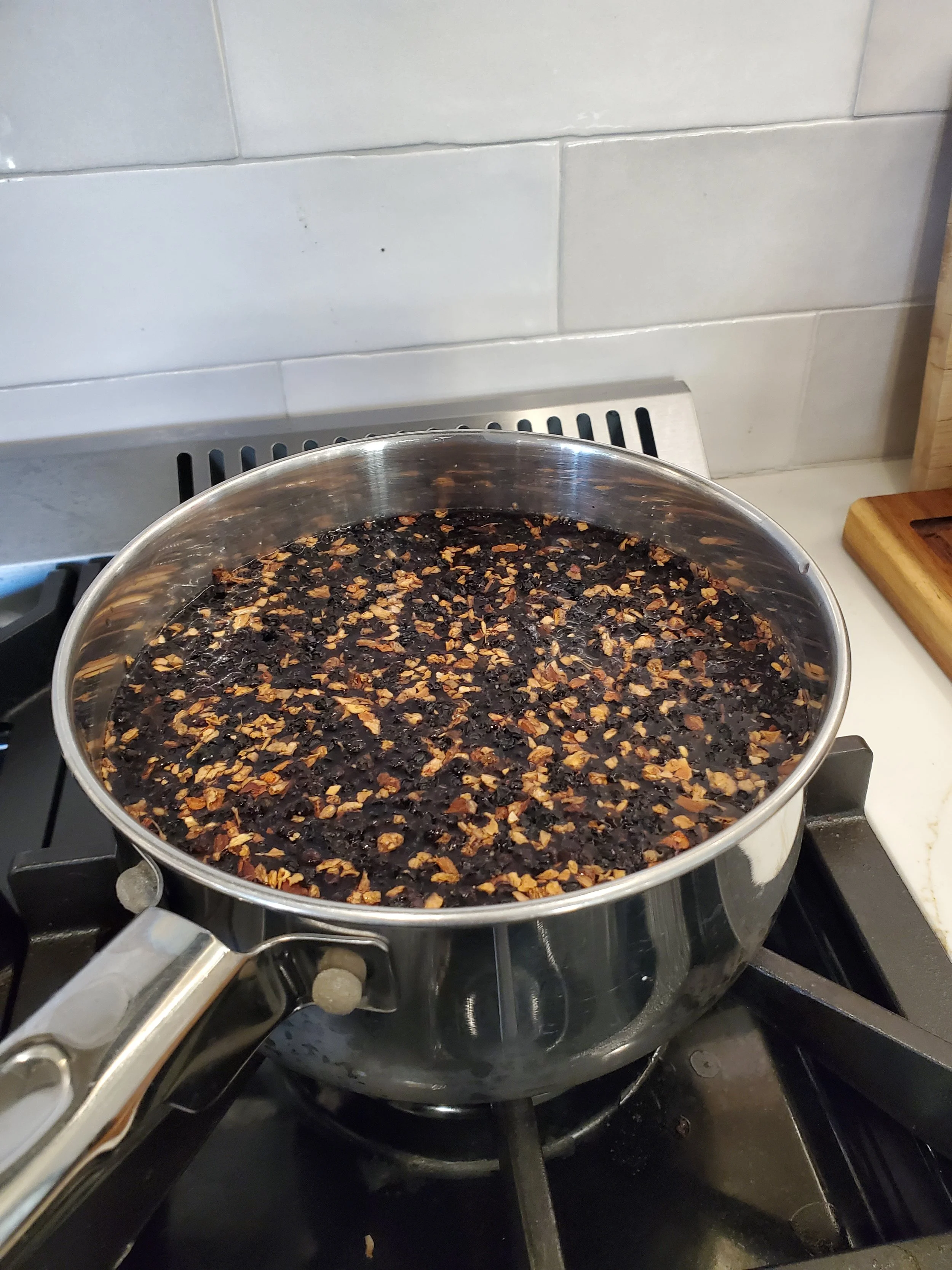 Elderberry syrup mixture on stovetop