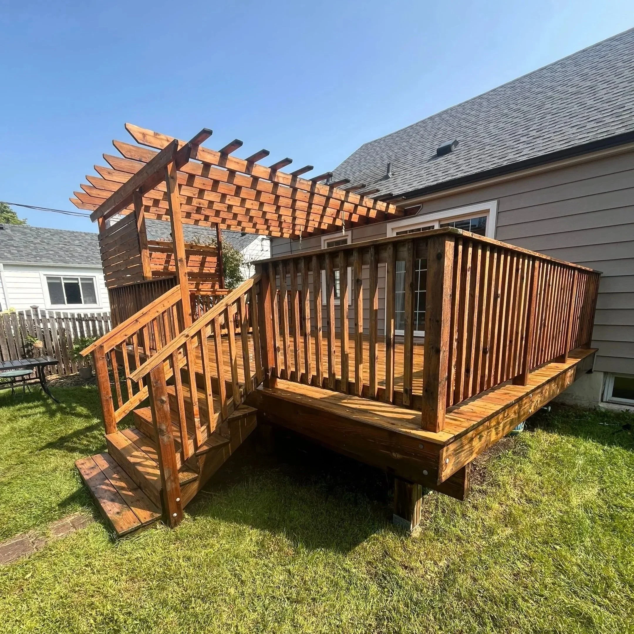 Restored cedar pergola after refinishing