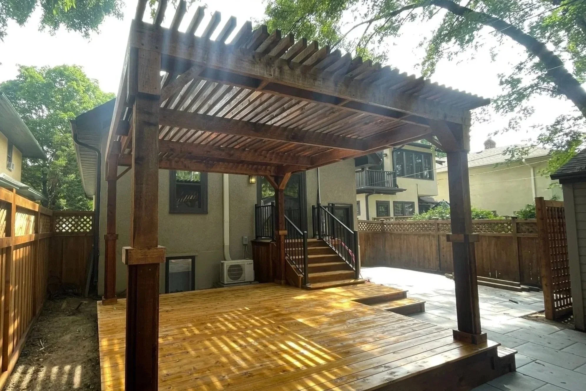 Oil-based penetration stain applied to pergola
