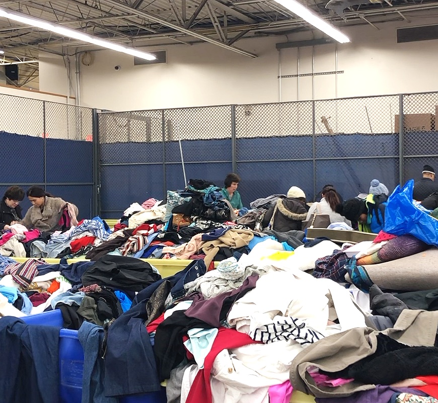 Priced-by-pound clothing bins at Goodwill in Roxbury, MA