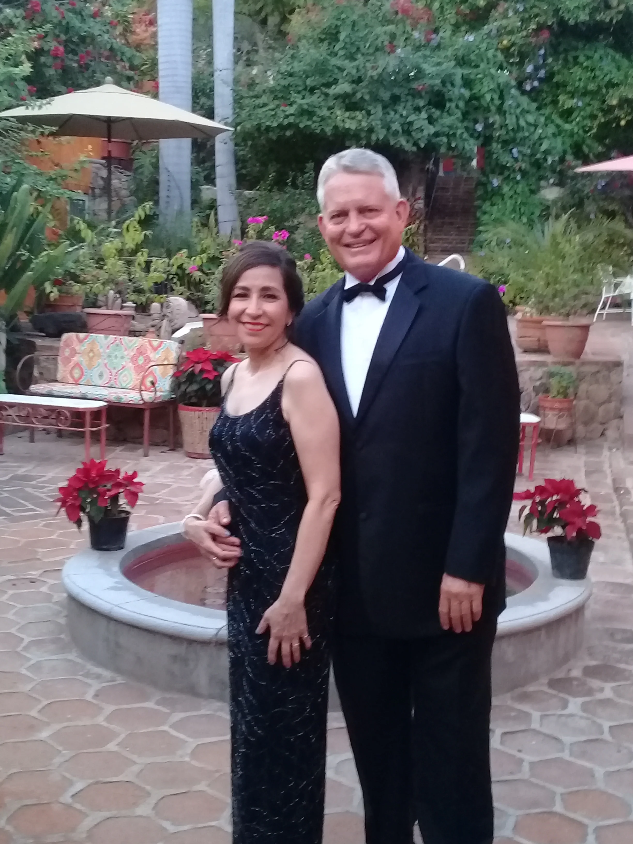 A beautiful couple are off to a wedding at Hacienda de los Santos just one half block away.