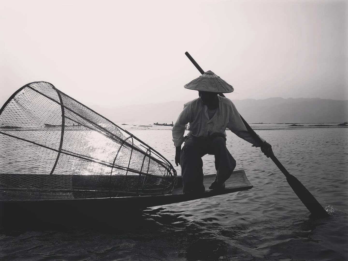 Fisherman in Inle Lake, Myanmar. 2016.
These guys typically pose for photos, using their bodies to create artworks for the passing tourists. Those shots are cool, but also something posed and the same as what everyone has. I liked capturing between