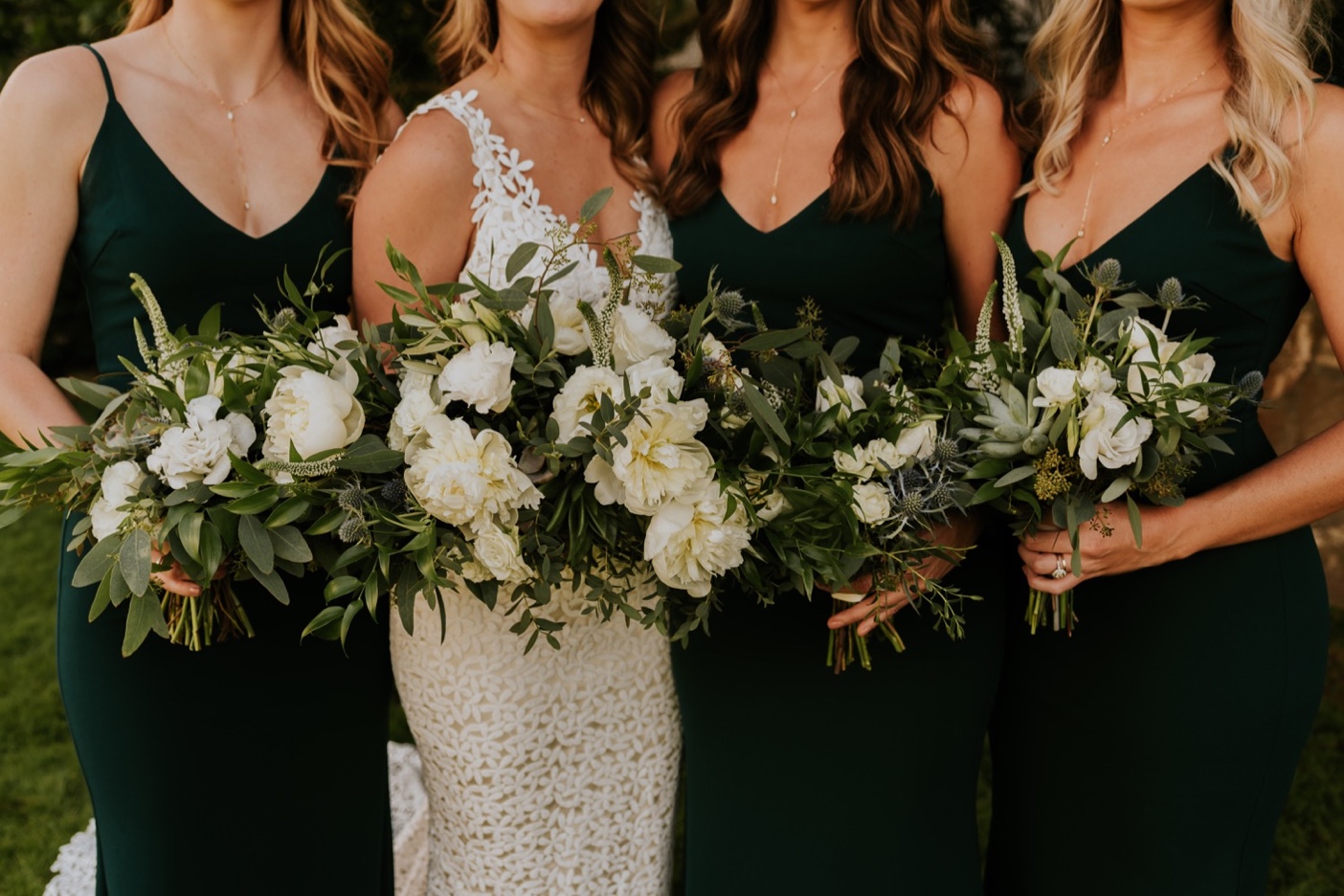 Bridesmaids in green dresses with bride. Wedding Floral Bouquets. Santa Barbara Courthouse Wedding.