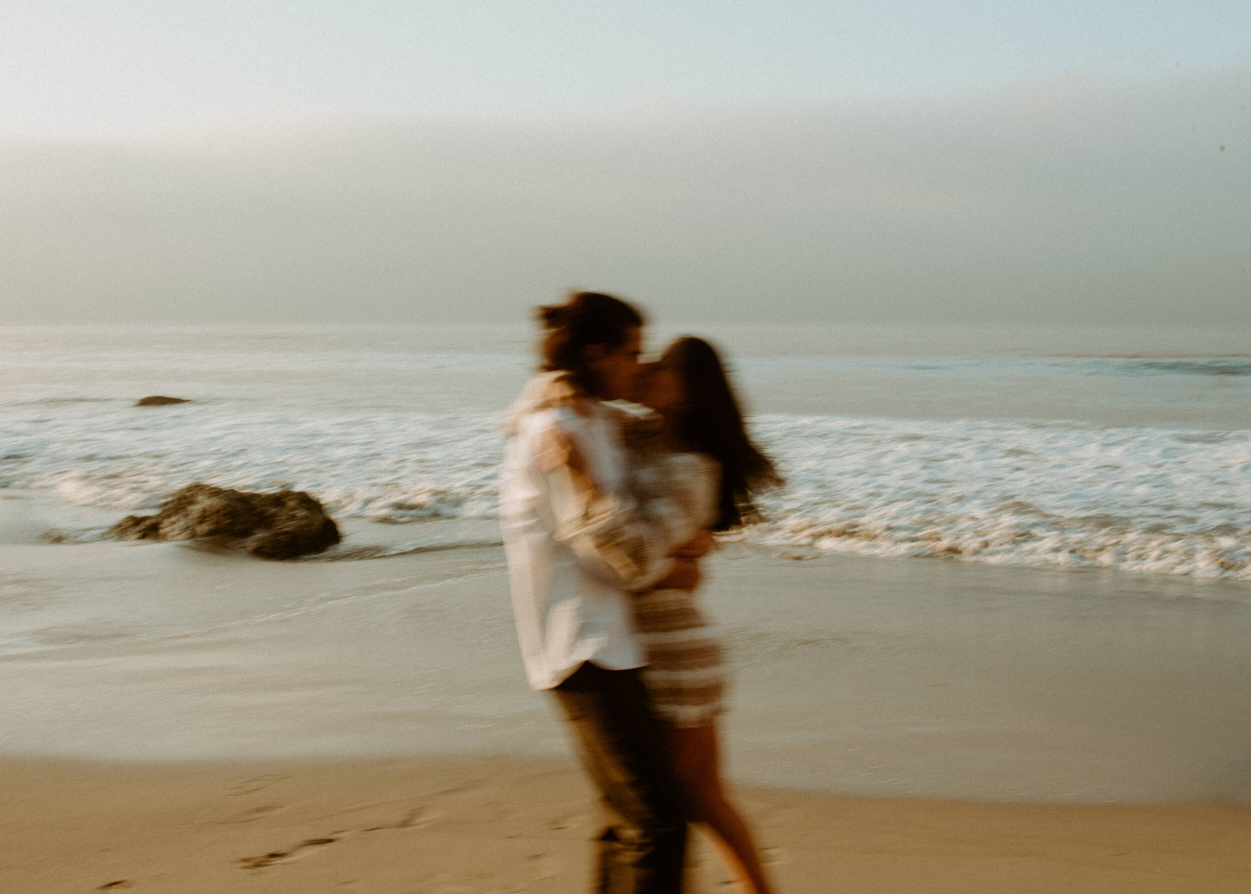 Sunrise Malibu Couples Photos | El Matador Beach Engagement Session | creative couples poses | sunrise at el matador beach | earthy neutral color couples outfits