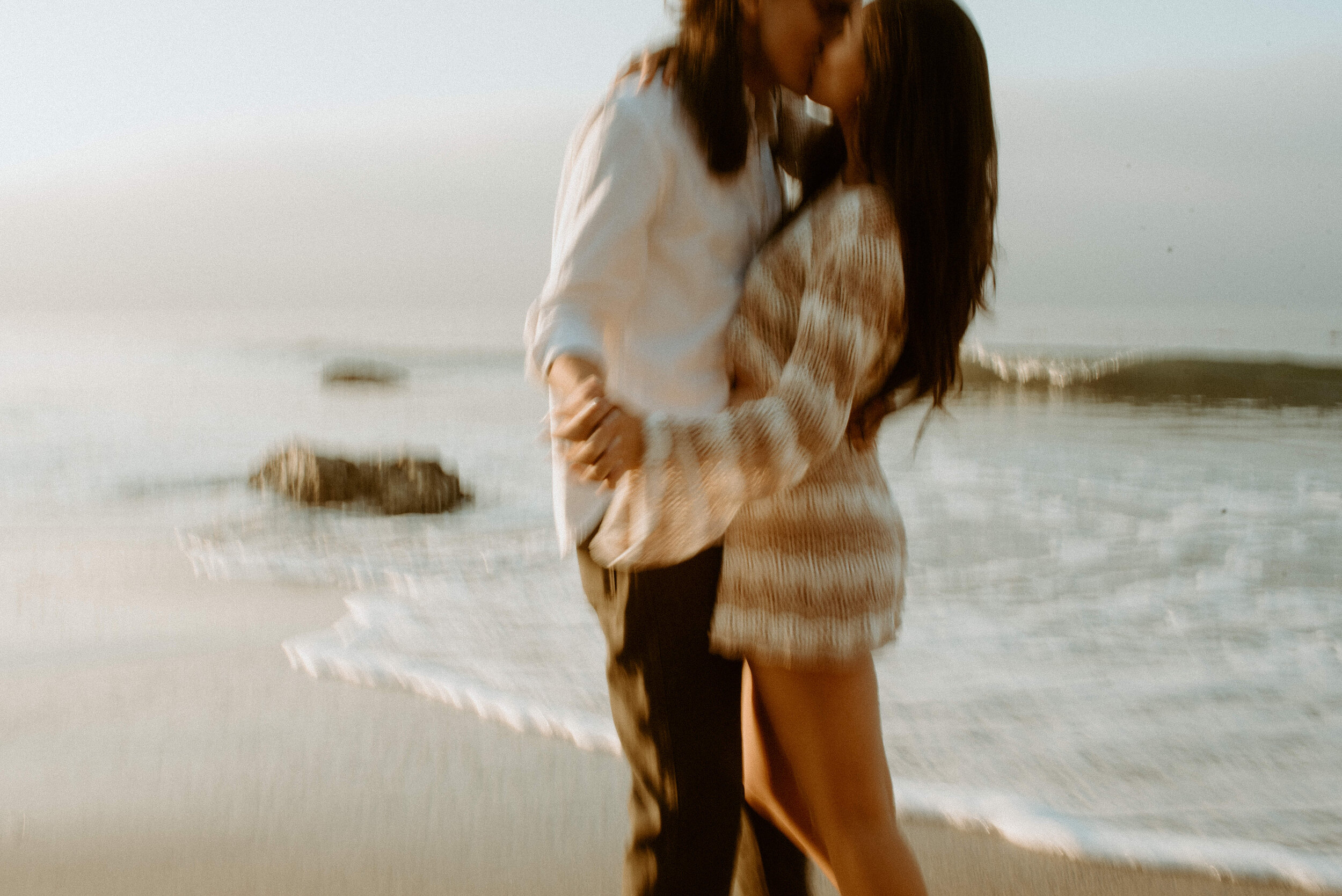 Sunrise Malibu Couples Photos | El Matador Beach Engagement Session | blurry creative couples poses | sunrise at el matador beach | earthy neutral color couples outfits