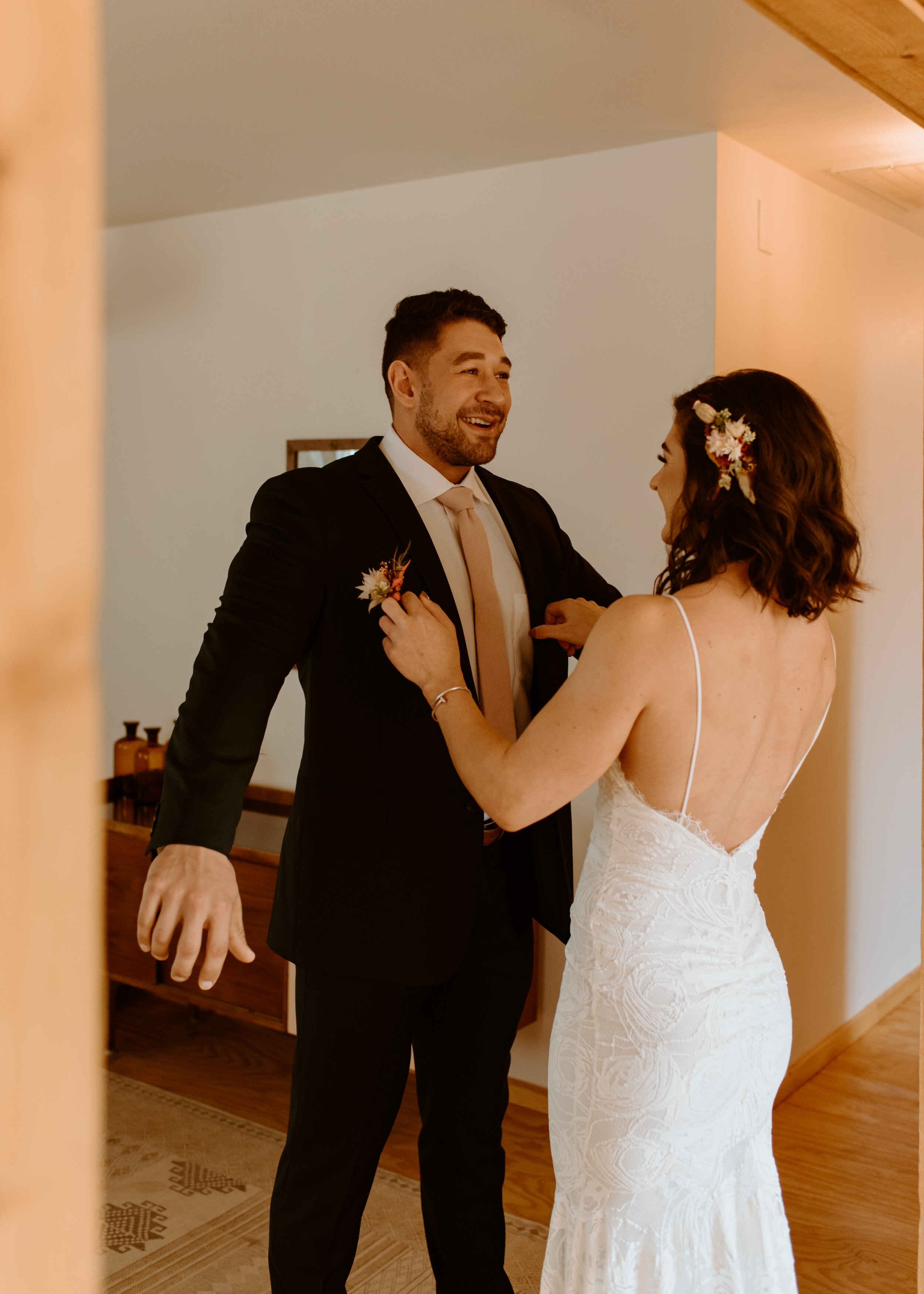 Laid-back Joshua Tree elopement | Boho bride in Grace Loves Lace dress | Joshua Tree elopement photographer | couple getting ready at airbnb for elopement