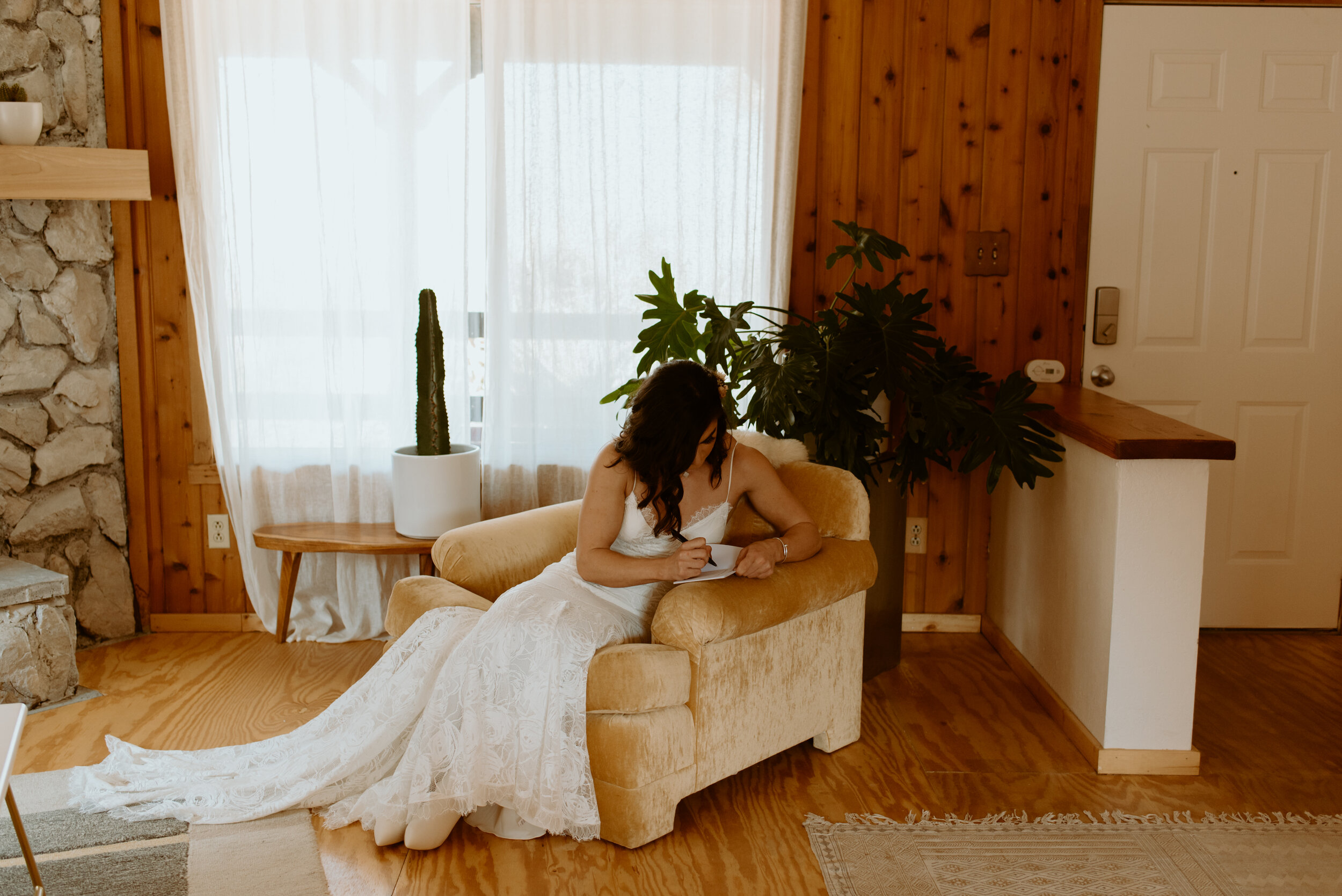 Laid-back Joshua Tree elopement | Boho bride in Grace Loves Lace dress | Joshua Tree elopement photographer | couple getting ready at airbnb for elopement
