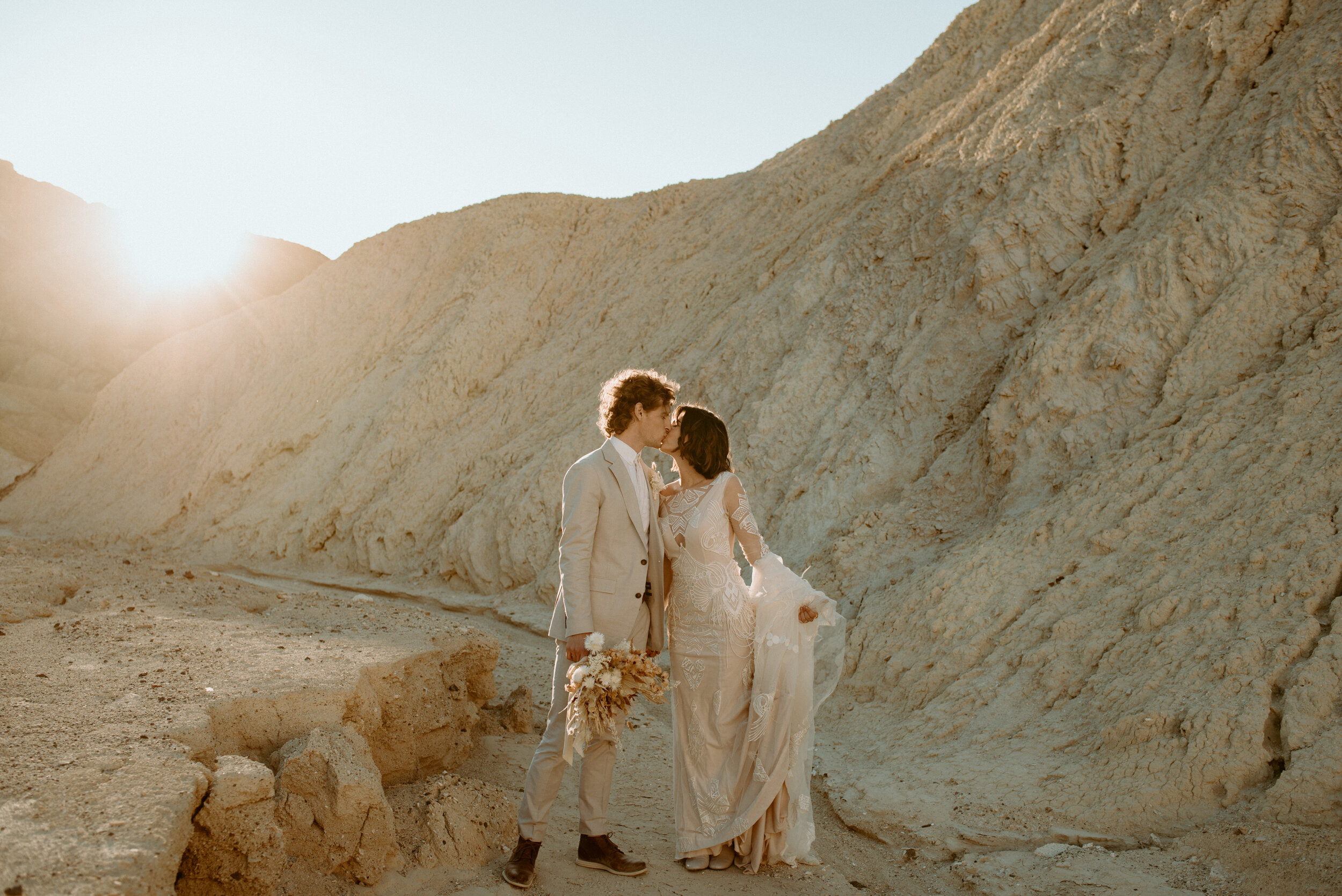 Death Valley National Park elopement | Zabriskie Point, Death Valley | California Elopement photographer | Death Valley wedding | neutral boho desert elopement | Daci Gowns | Dried floral bouquet