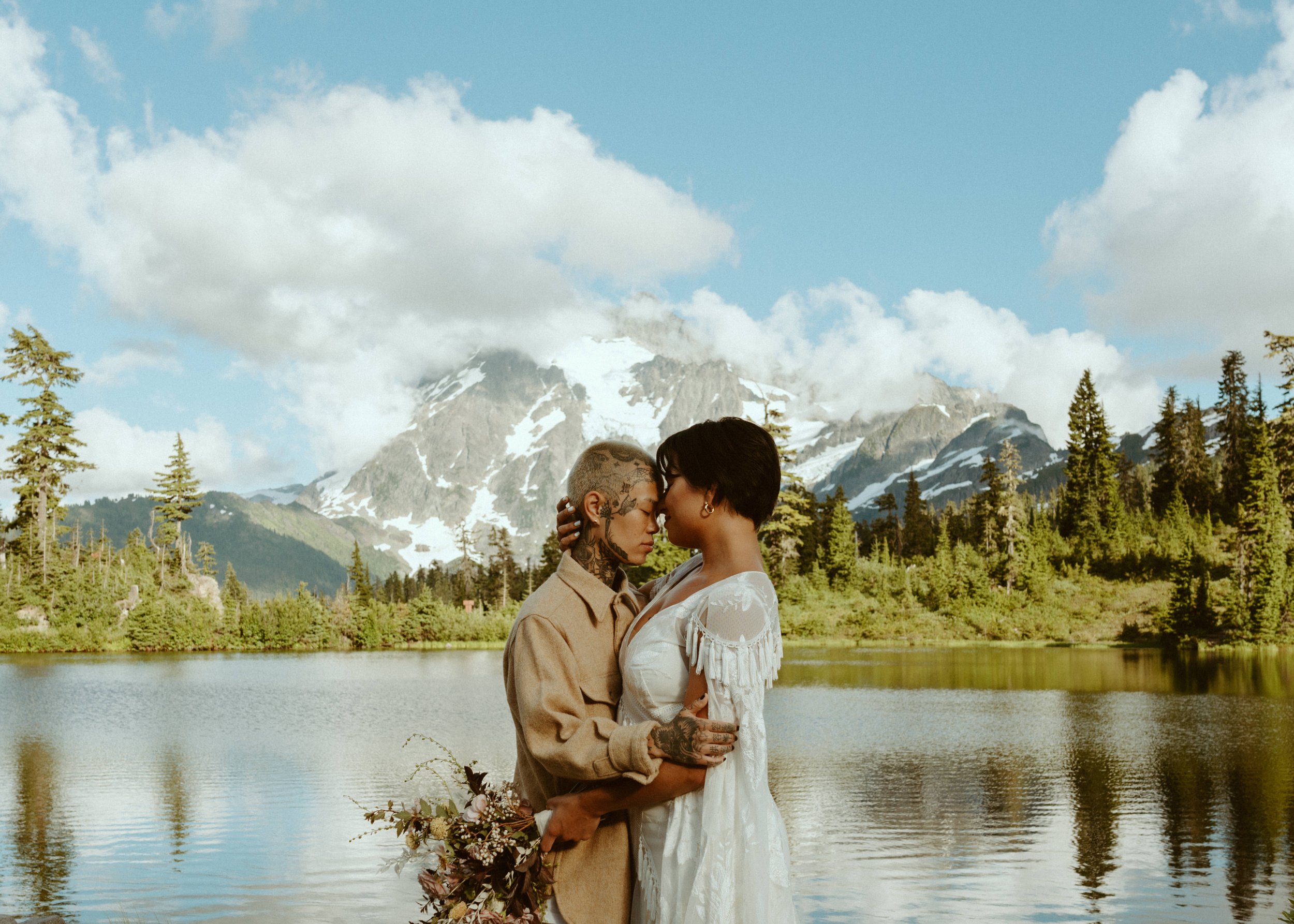 Two brides hugging at Picture Lake / Mt Baker Washington Elopement 