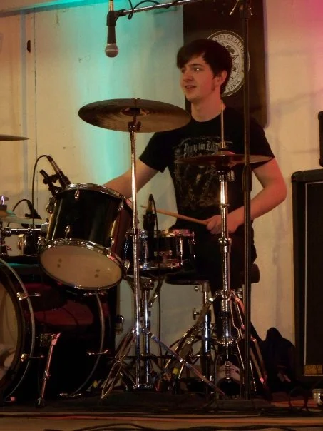 zach drums bonfire.jpg