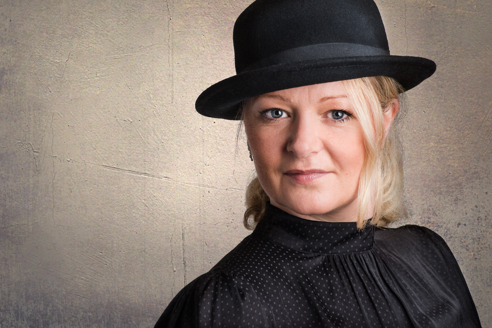 woman in bowler hat