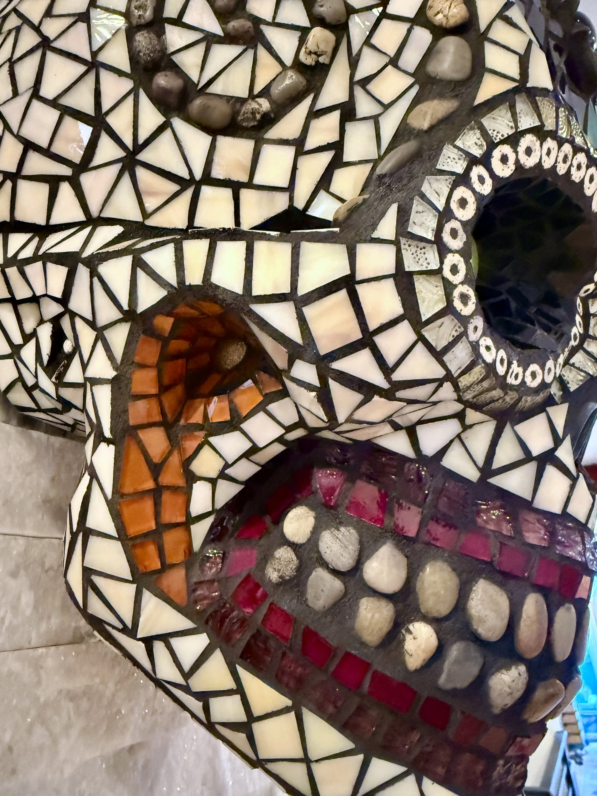 'Muerte Natural' Mosaic skull (detail)
mixed media: stained glass, natural stones, metal hardware, beads. 
15"h x 10"w x 9"d. 