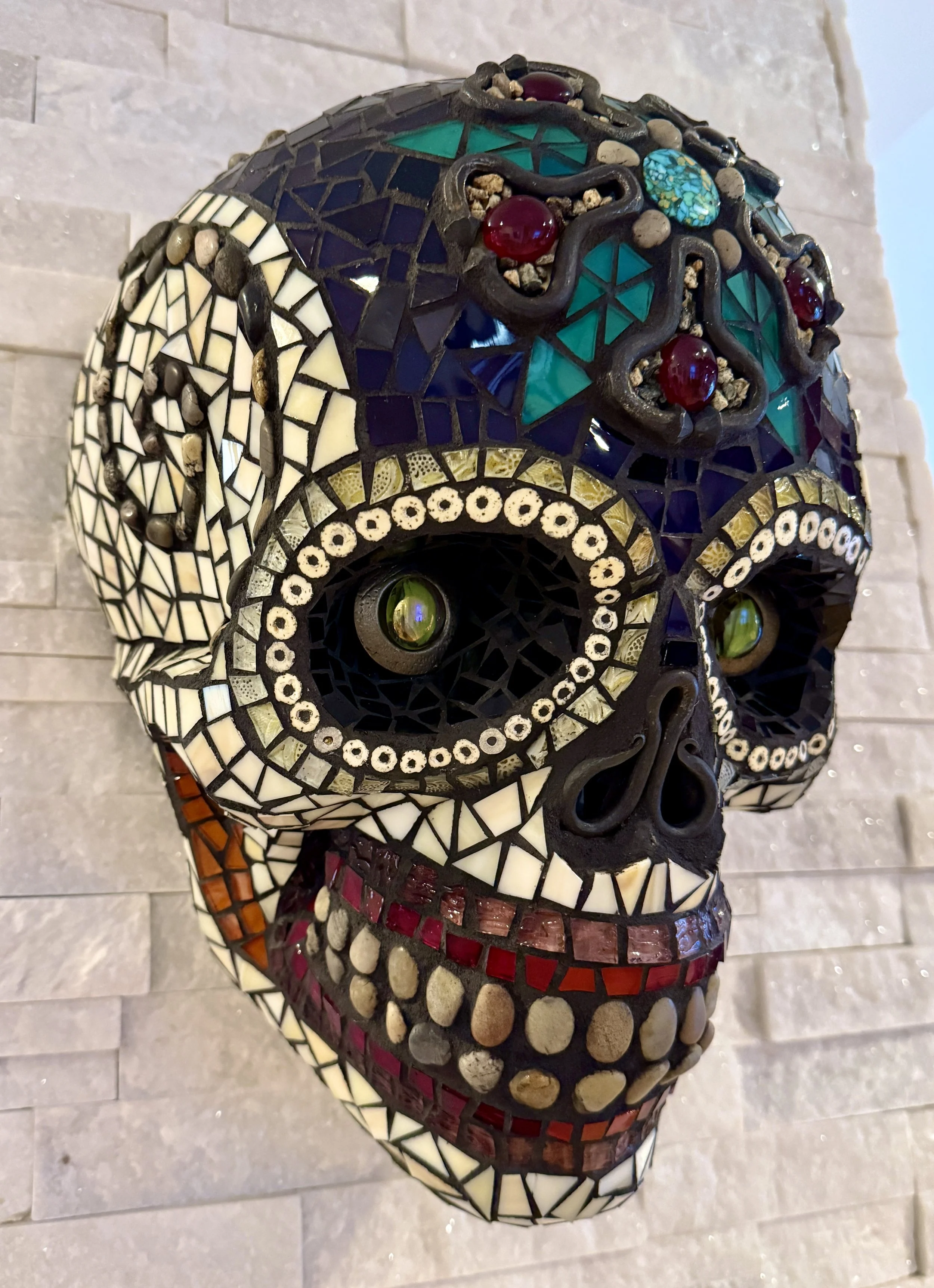 'Muerte Natural' Mosaic skull 
mixed media: stained glass, natural stones, metal hardware, beads. 
15"h x 10"w x 9"d. 