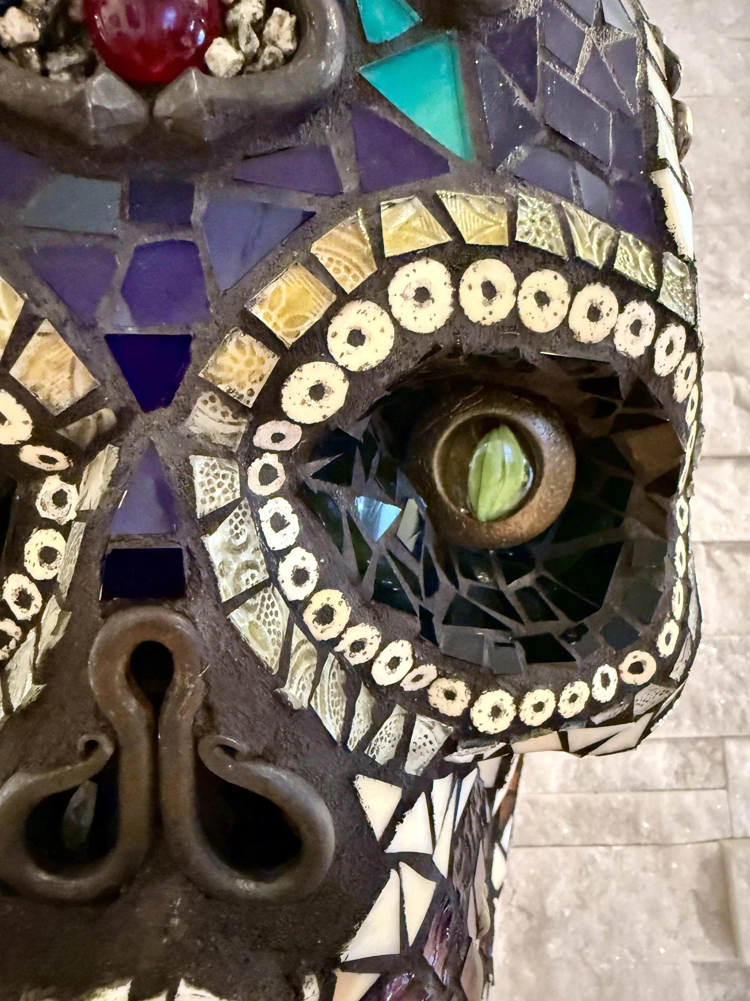 'Muerte Natural' Mosaic skull (detail)
mixed media: stained glass, natural stones, metal hardware, beads. 
15"h x 10"w x 9"d. 