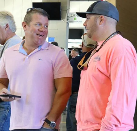 Mark Womack and Chris Clark talk about the vehicles in the lanes at Greenville Auto Auction.