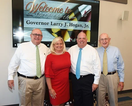 Governor Larry Hogan (2nd from right) visits with the Nichols family during his tour of BSC America's Bel Air Auto Auction in August. He paused for a photo with (left to right) R. Charles Nichols, BSC America's President; Michelle Nichols-Neff, Executive Vice President, and Raymond Nichols, Chairrman and CEO.