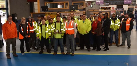 Scott Bostwick (front, center) with the Barber family and the first shift of State LIne Auto Auction's reconditioning team, of which Scott has been a part for the entirety of his 20-year career at the auction.