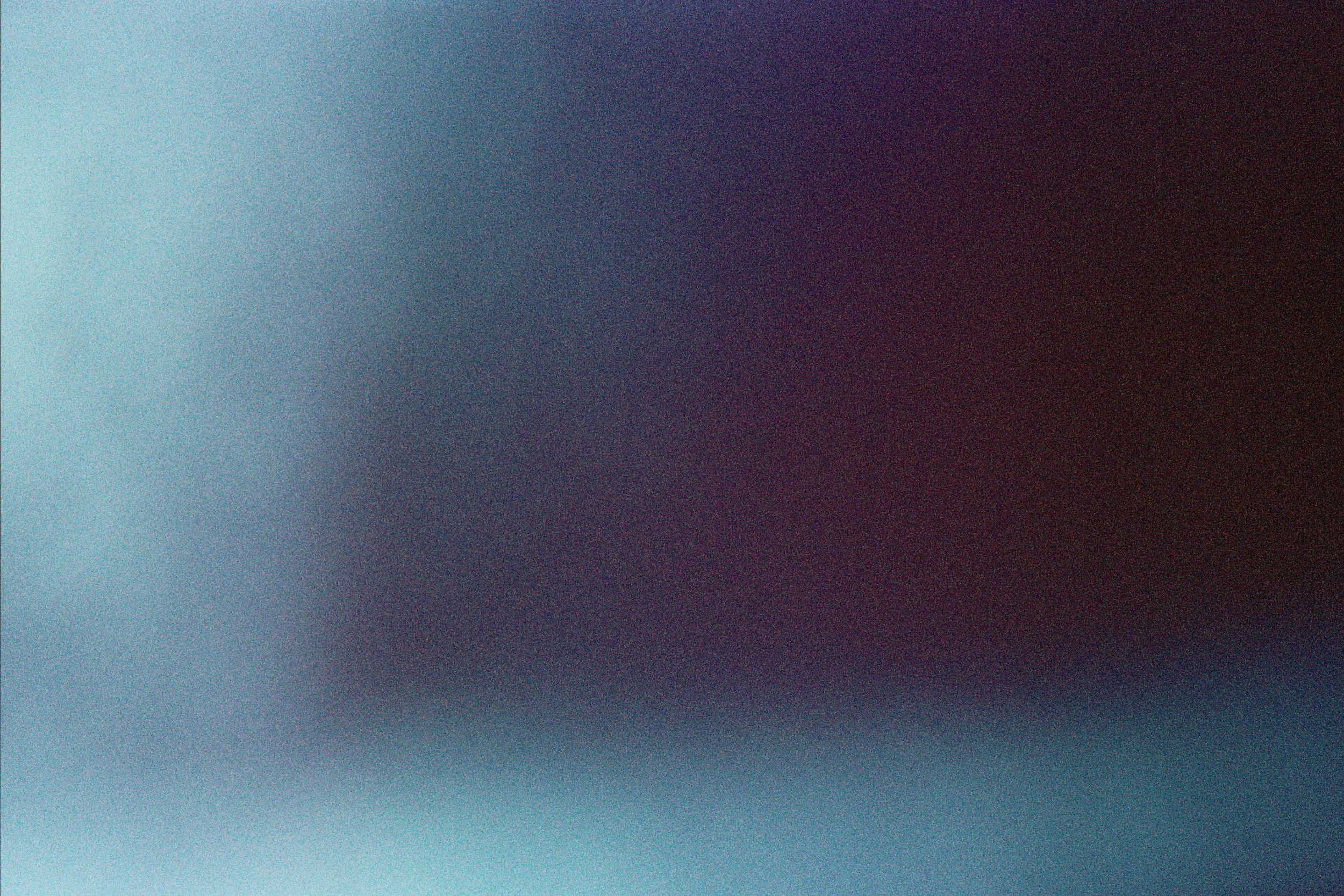 Abstract gradient with dark purple and blue hues blending smoothly.