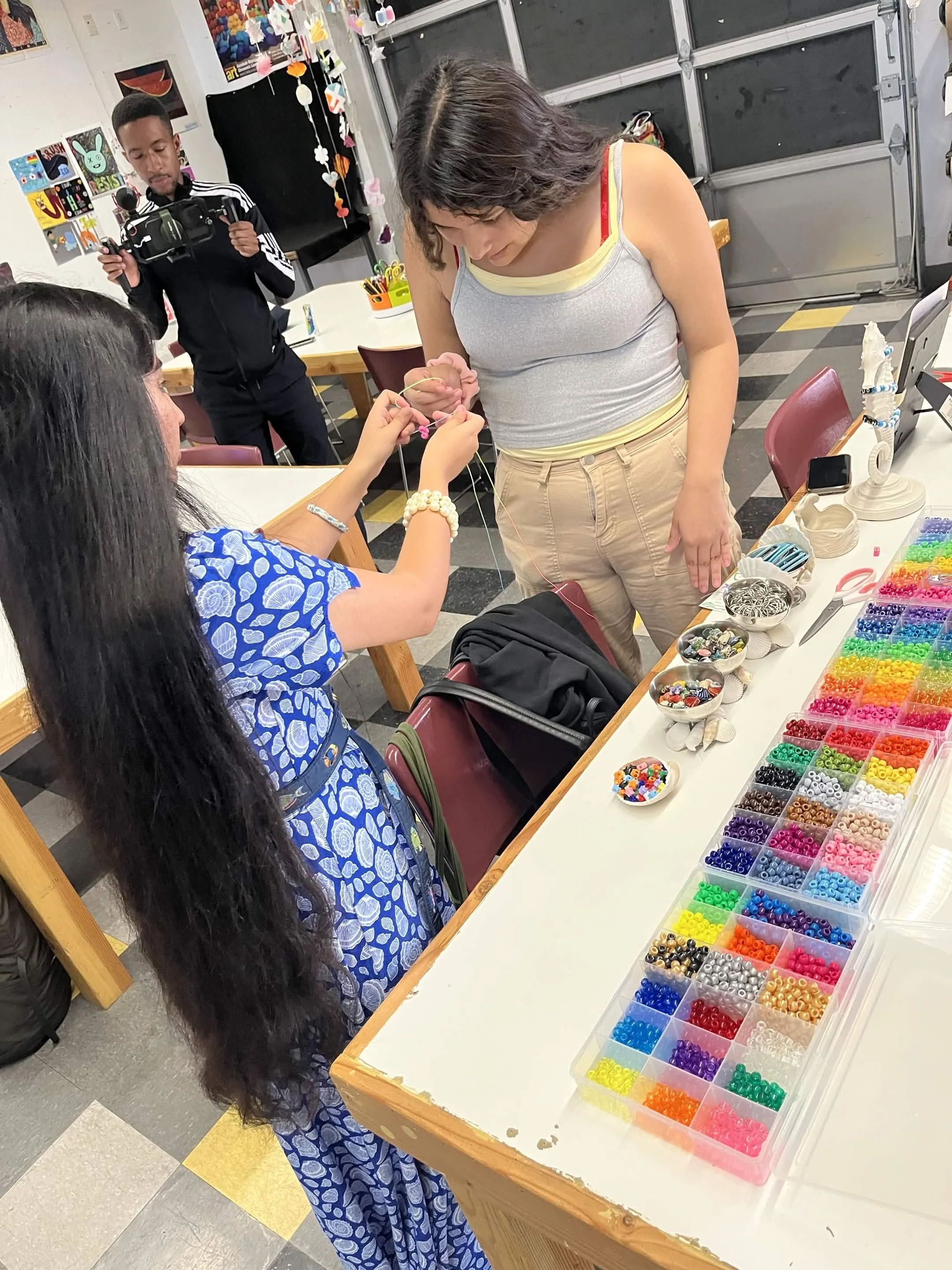 Gwenevere giving hands on instruction at an Integrated Beaded Jellyfish Lecture & Workshop