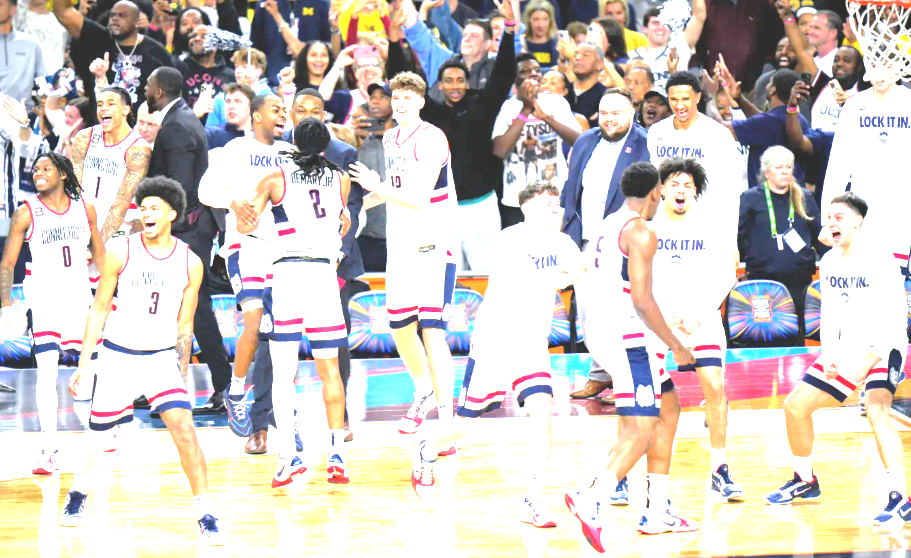 Final Fours: M-Michigan dominates Arizona, UConn handles Illinois; W-Upstarts vs. Dynasty, Geno apologizes